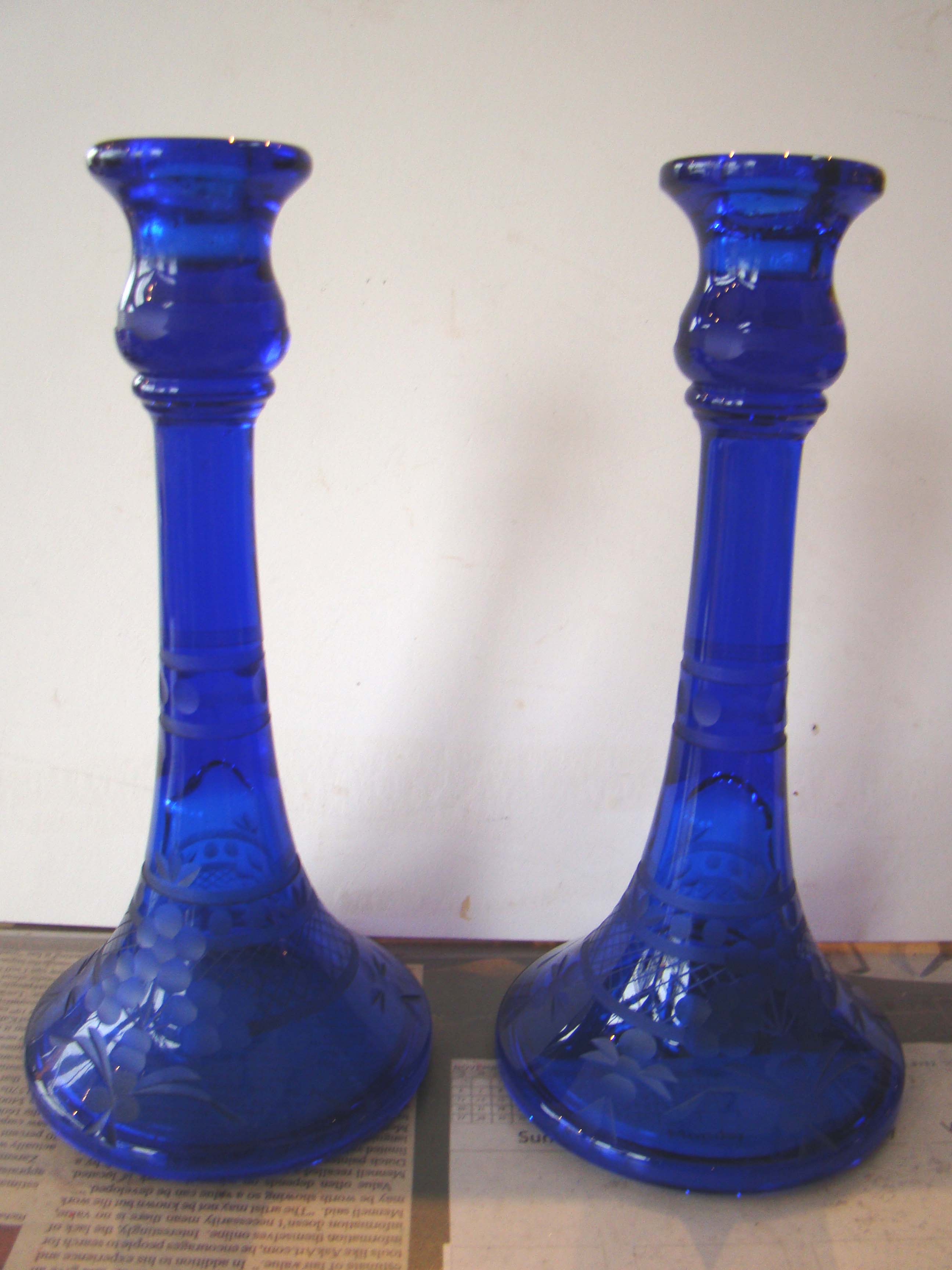 A beautiful pair of vintage etched cobalt candlesticks
