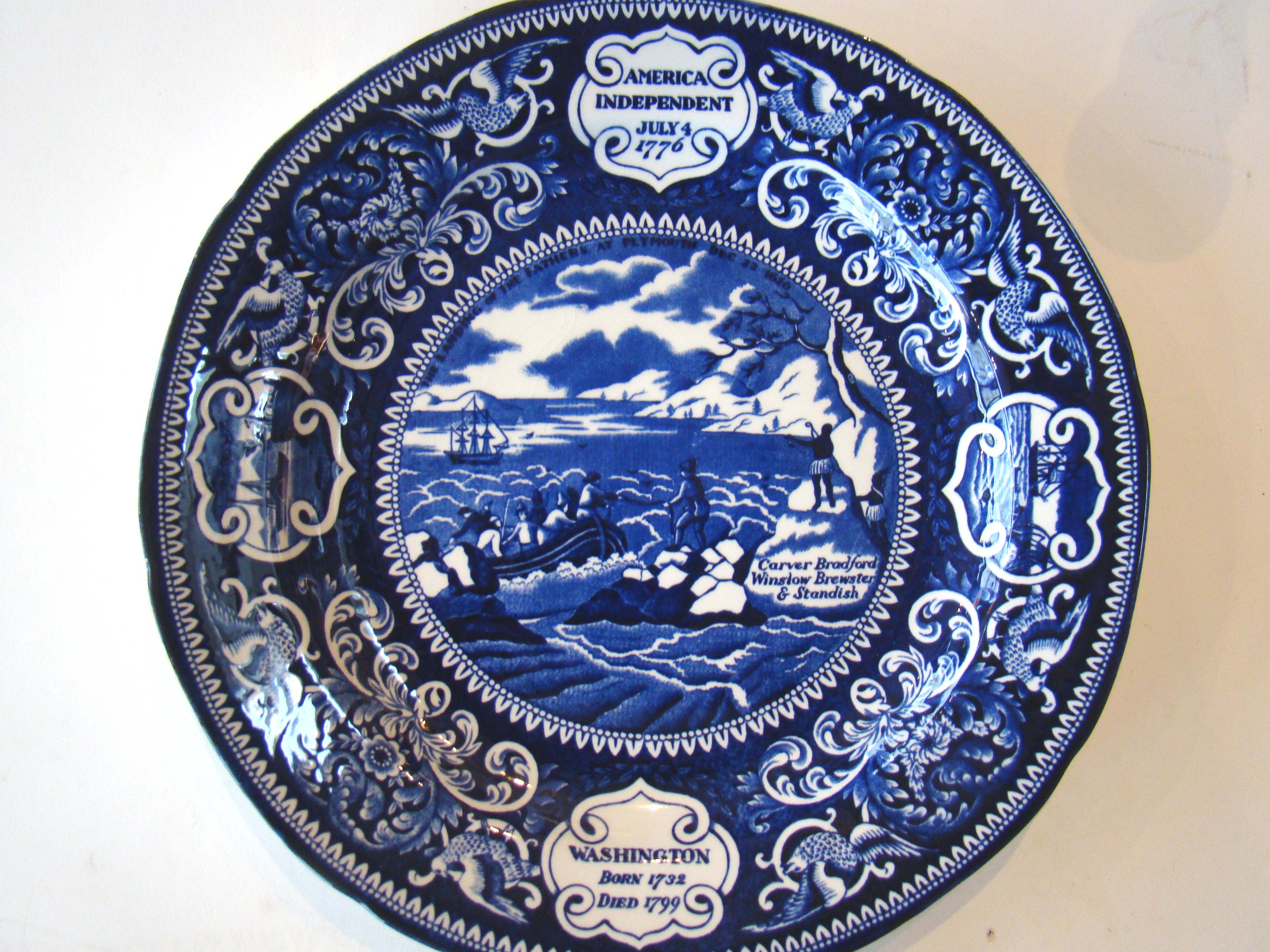 A vintage commemorative plate featuring George Washington, American Independence and the Landing of Pilgrims. Made by Jonroth.