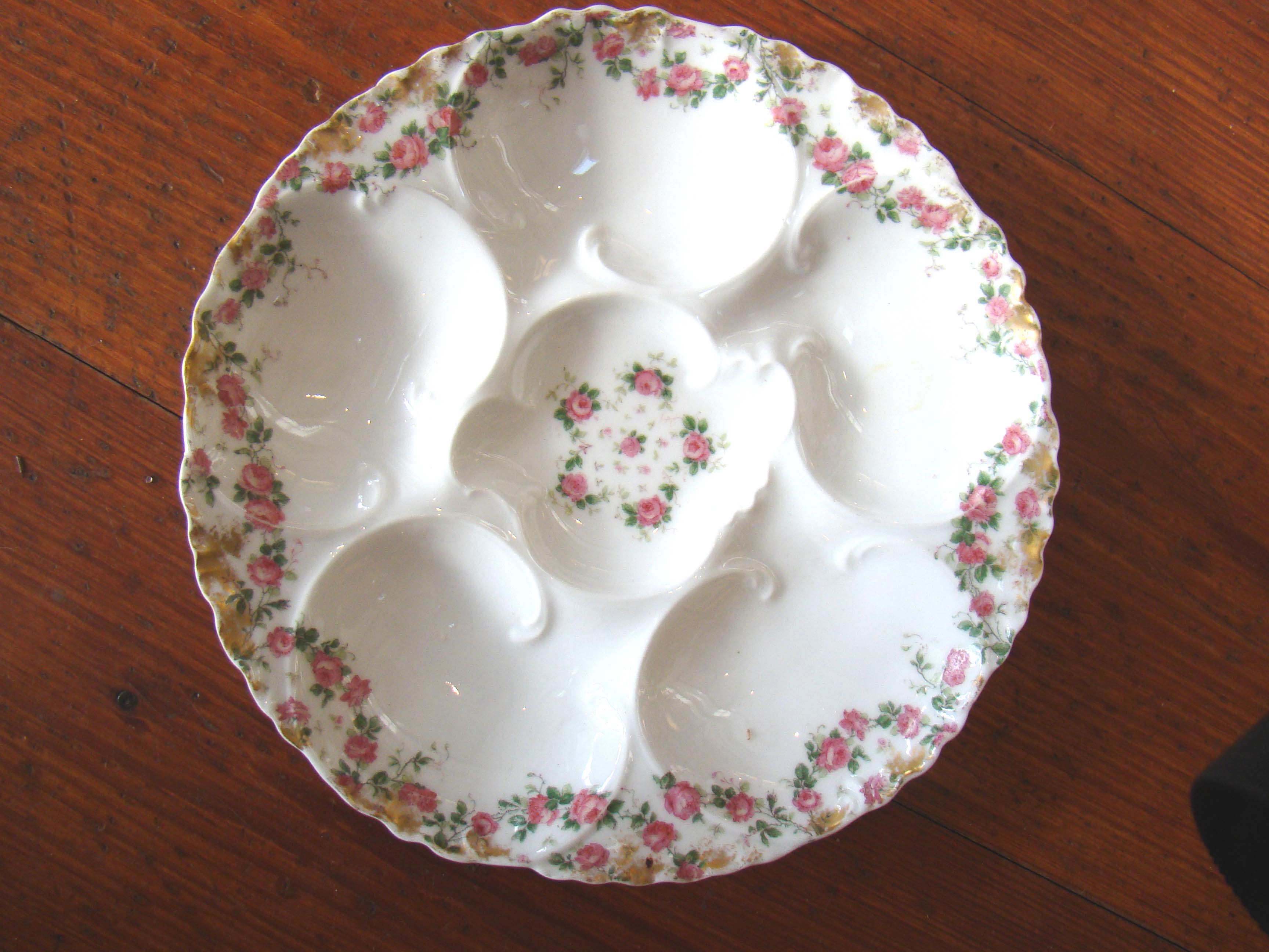 A fine Limoges oyster plate in blue morning glories and pink chrysanthemums made circa 1889