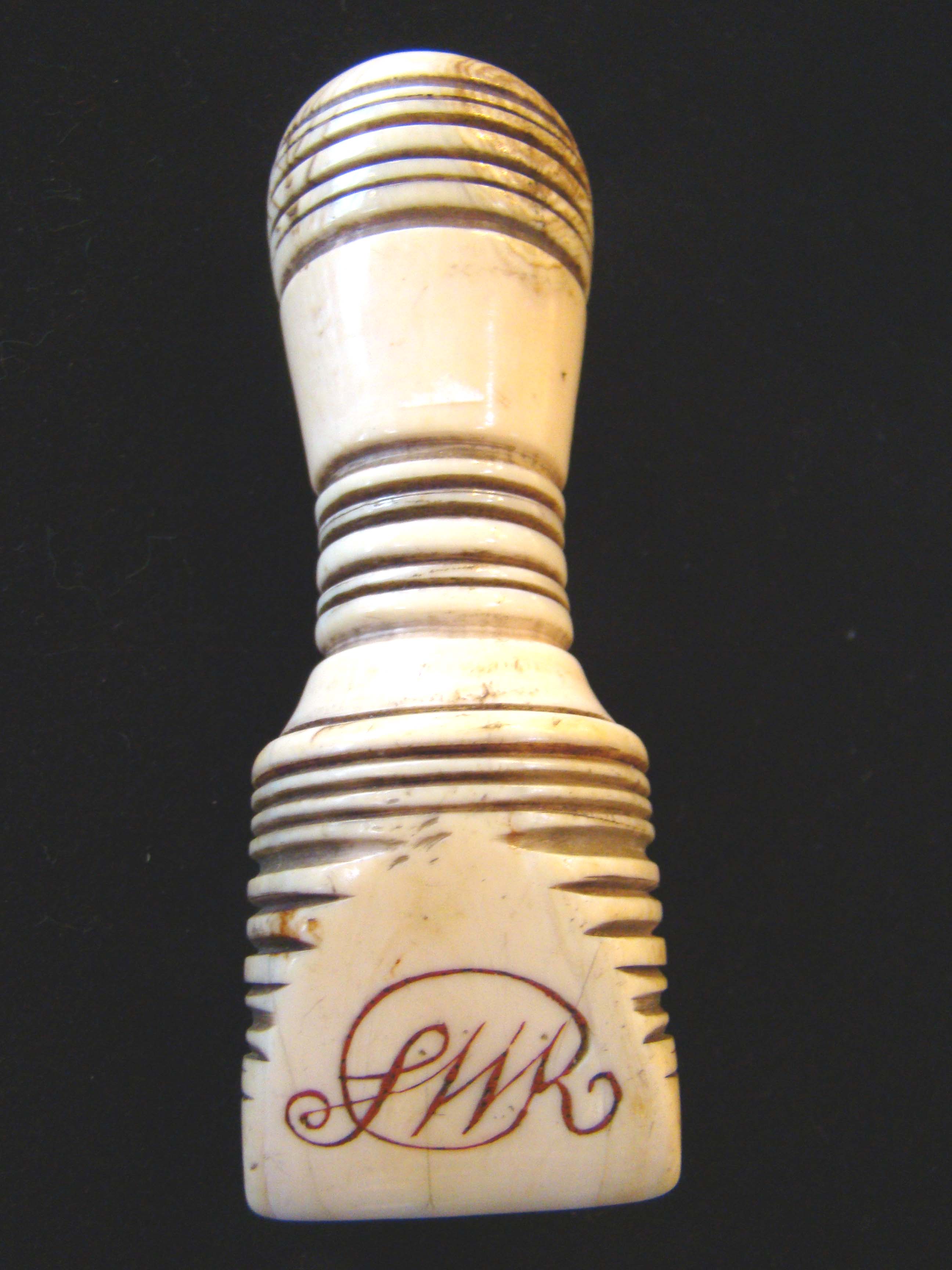 A beautiful sailor carved seam rubber made from a whale's tooth and inscribed "Mary 1823" — image 2