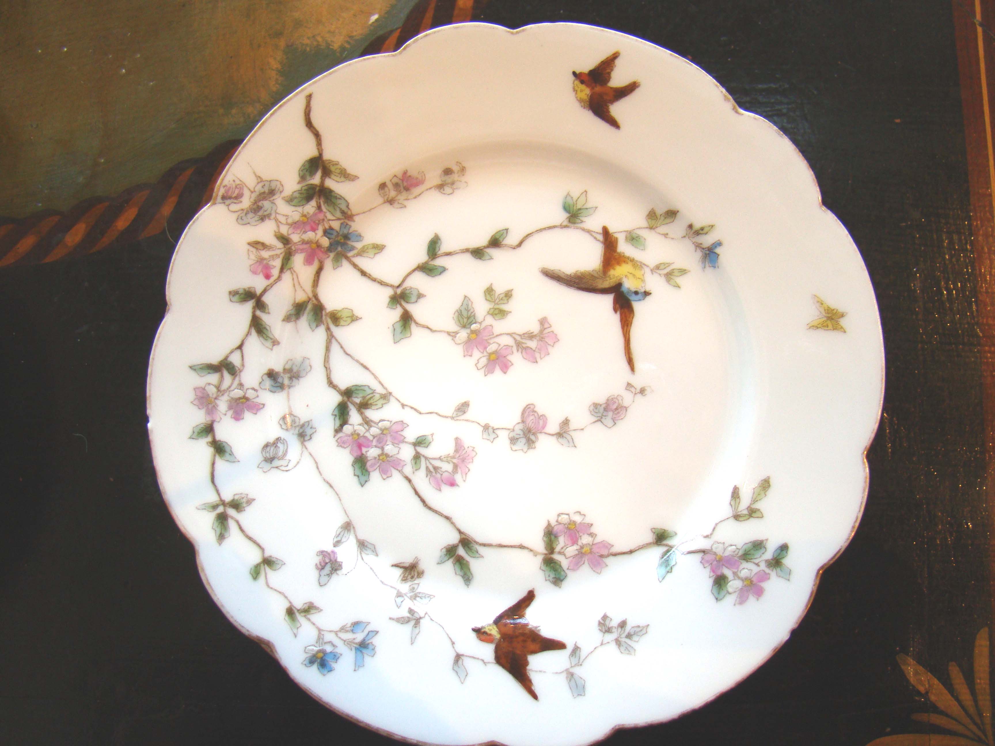 A gorgeous set of six hand painted side plates made by Royal Bayreuth circa 1890