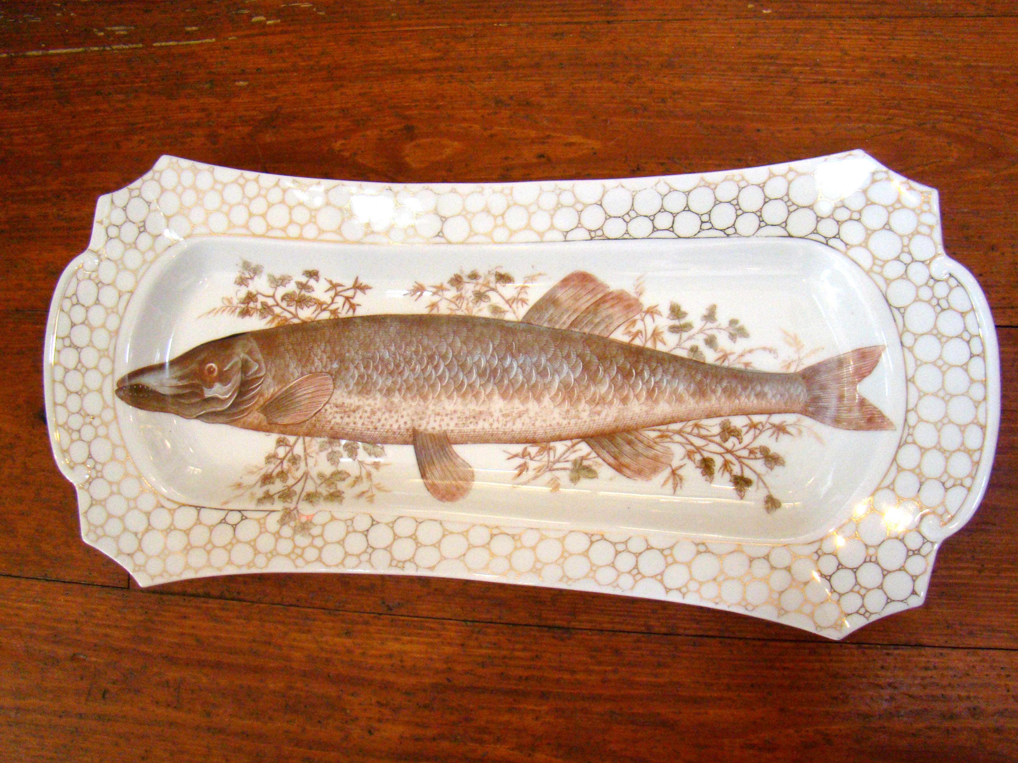 A fine vintage hand painted Fish serving platter with nine matching serving plates circa 1910