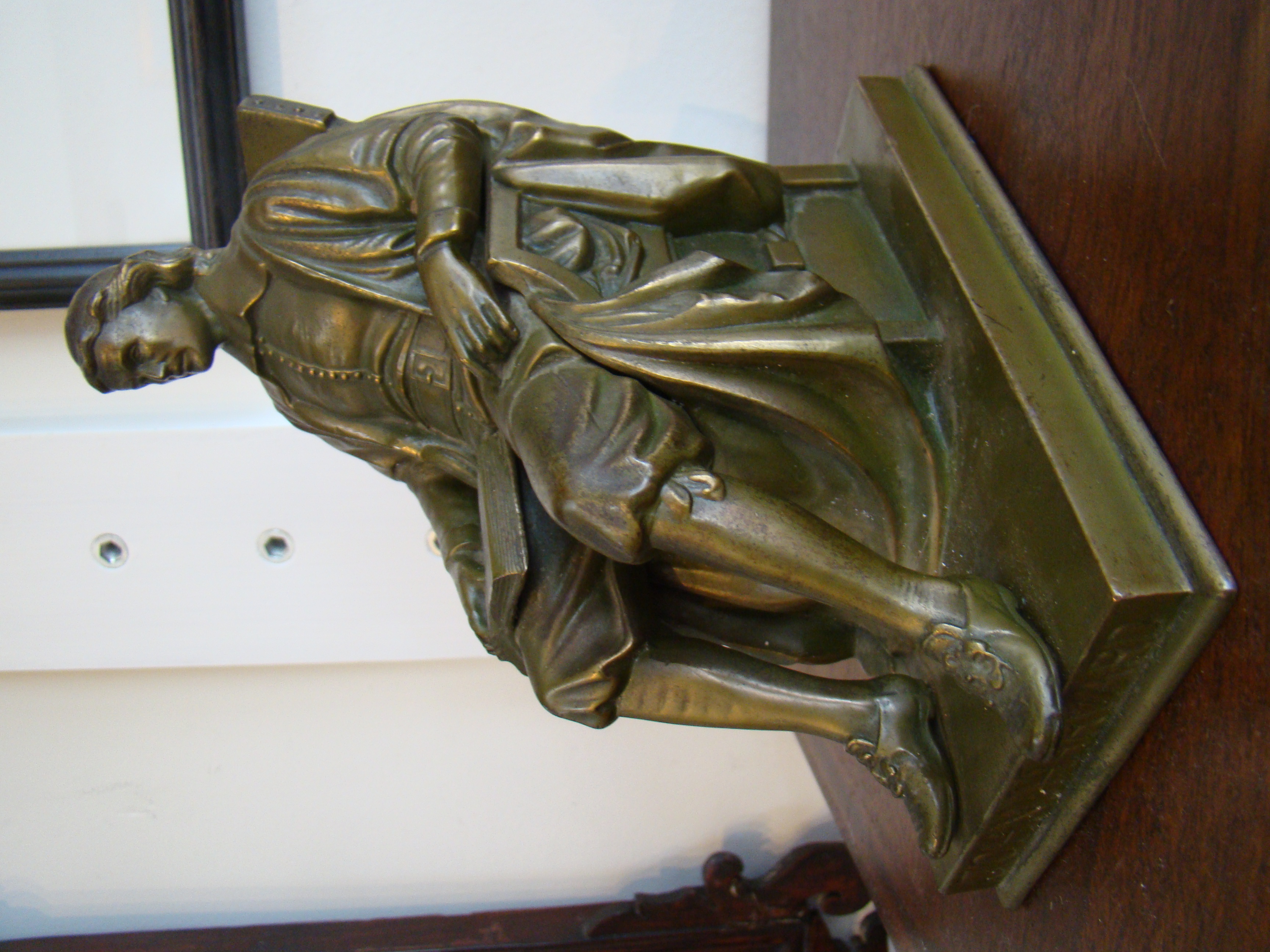 A fine JOHN HARVARD bookend made by Jennings Brothers circa 1930