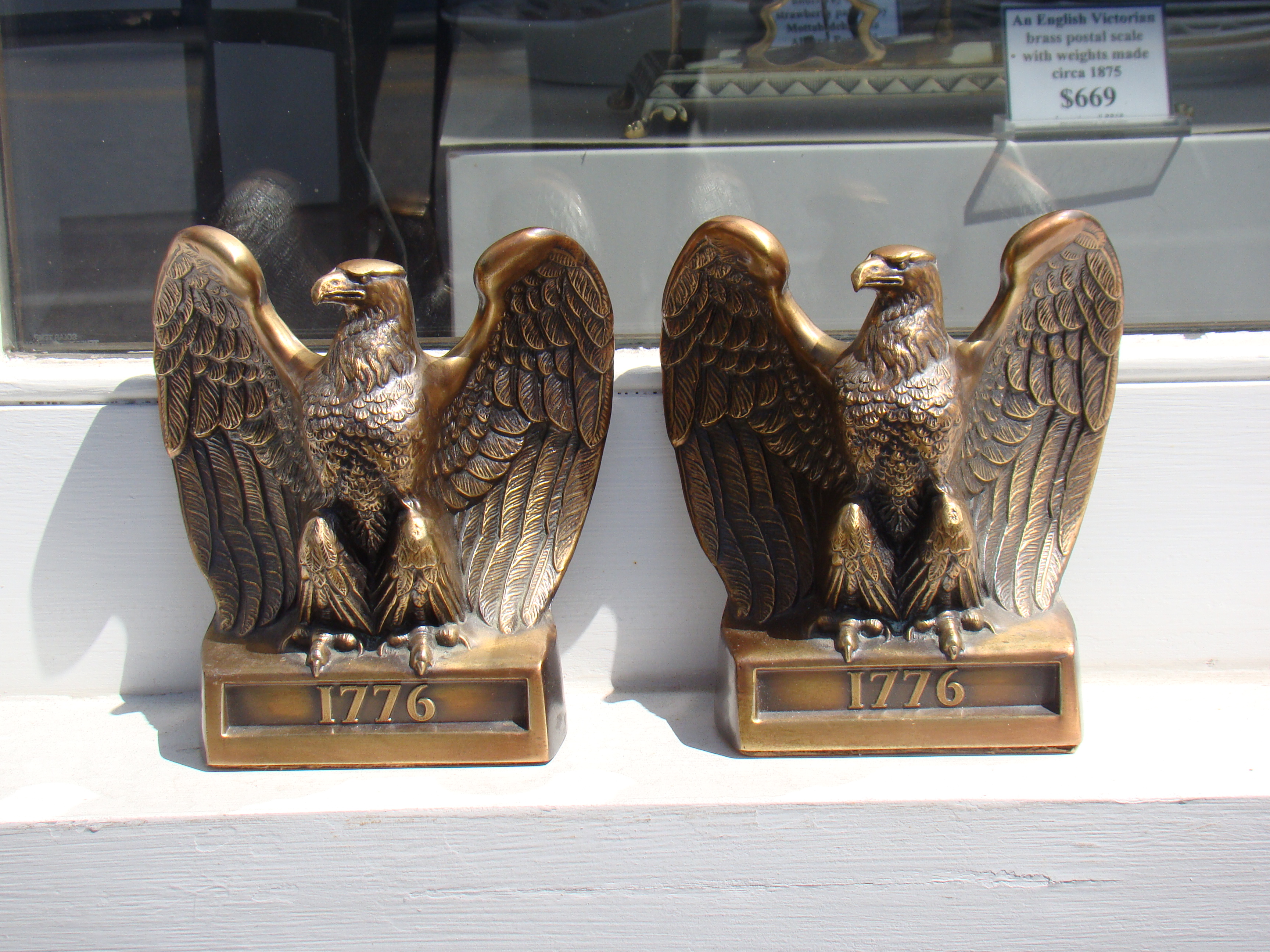 A fine pair of American bicentennial brass bookends with the date"1776"