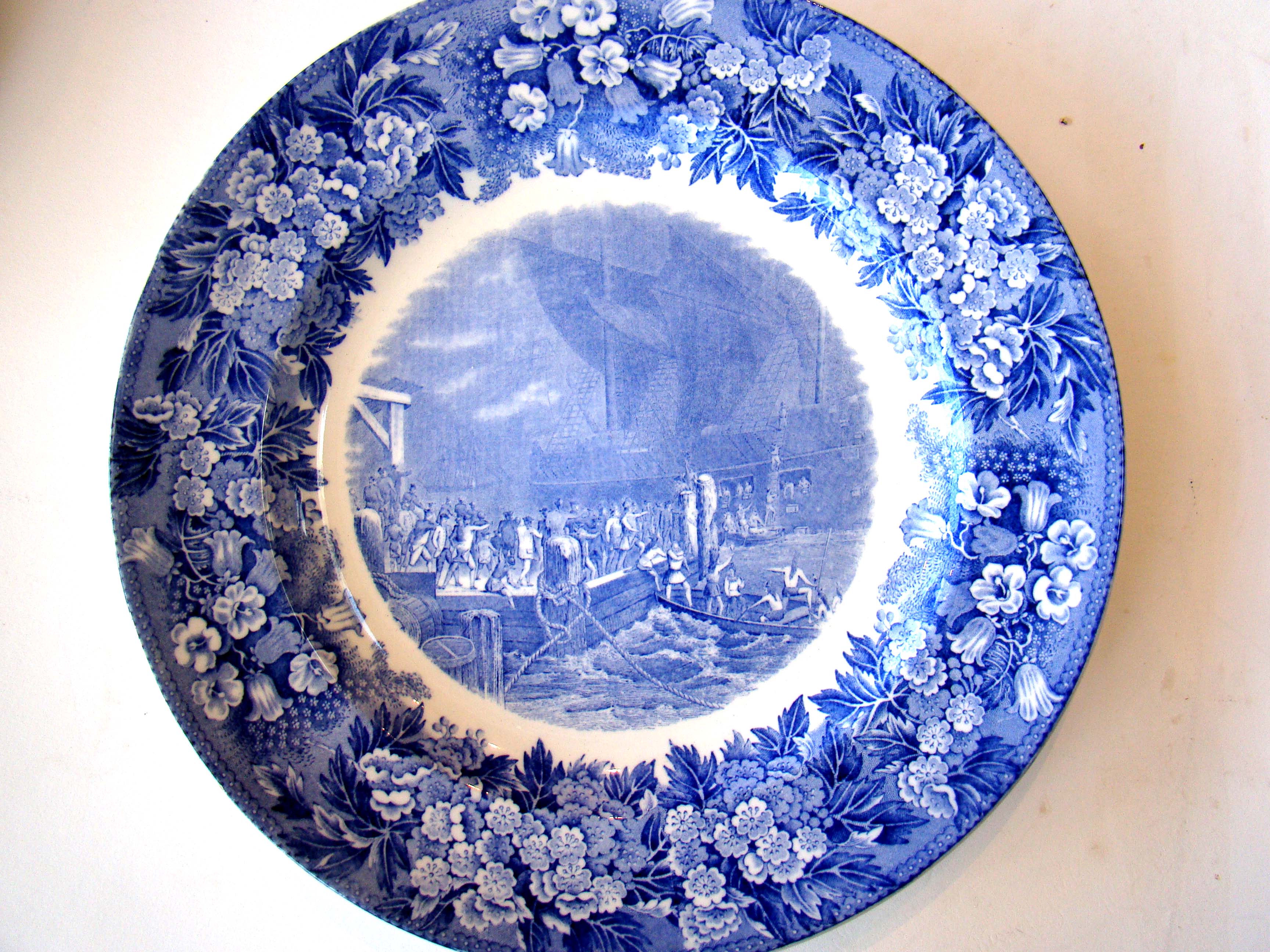 An historic and rare plate depicting "The Boston Tea Party" Dec. 16, 1773 and later signed in 1930 by Mayor James Curley to commemorate Boston's tercentennary.
