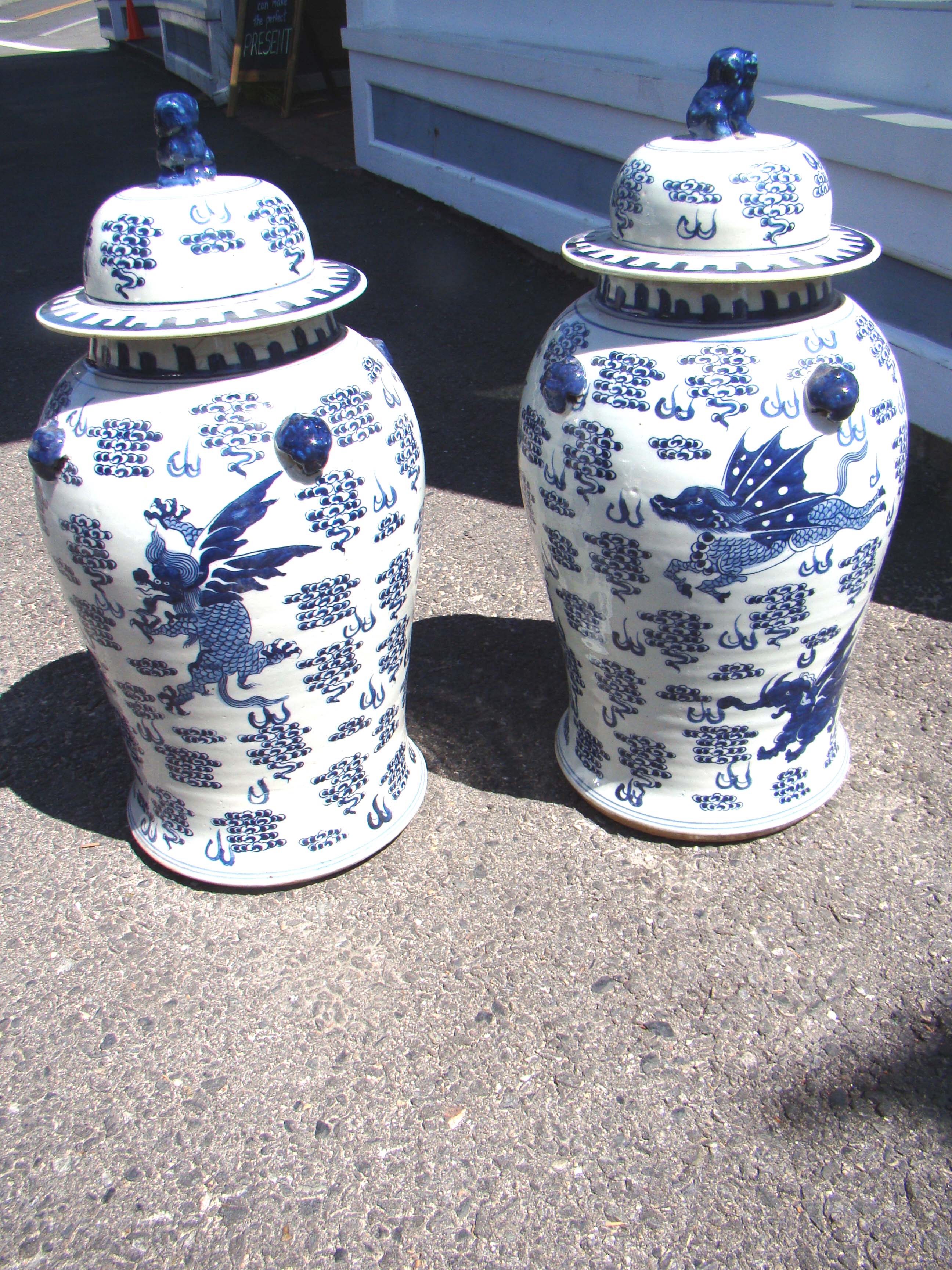 A fine pair of Chinese Temple Jars with mythical flying creatures