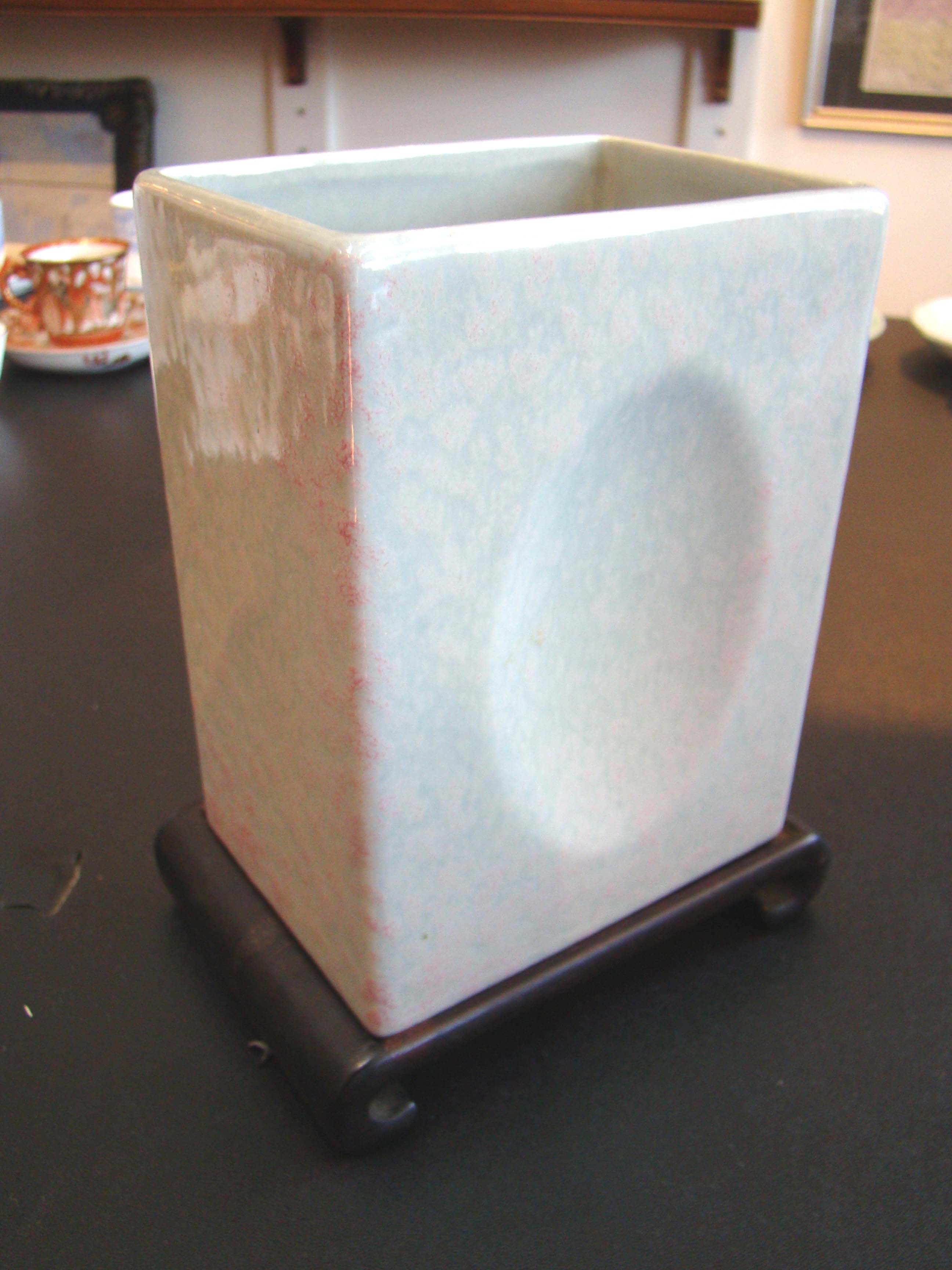 A Chinese square 'dimple' form vase on a teakwood stand