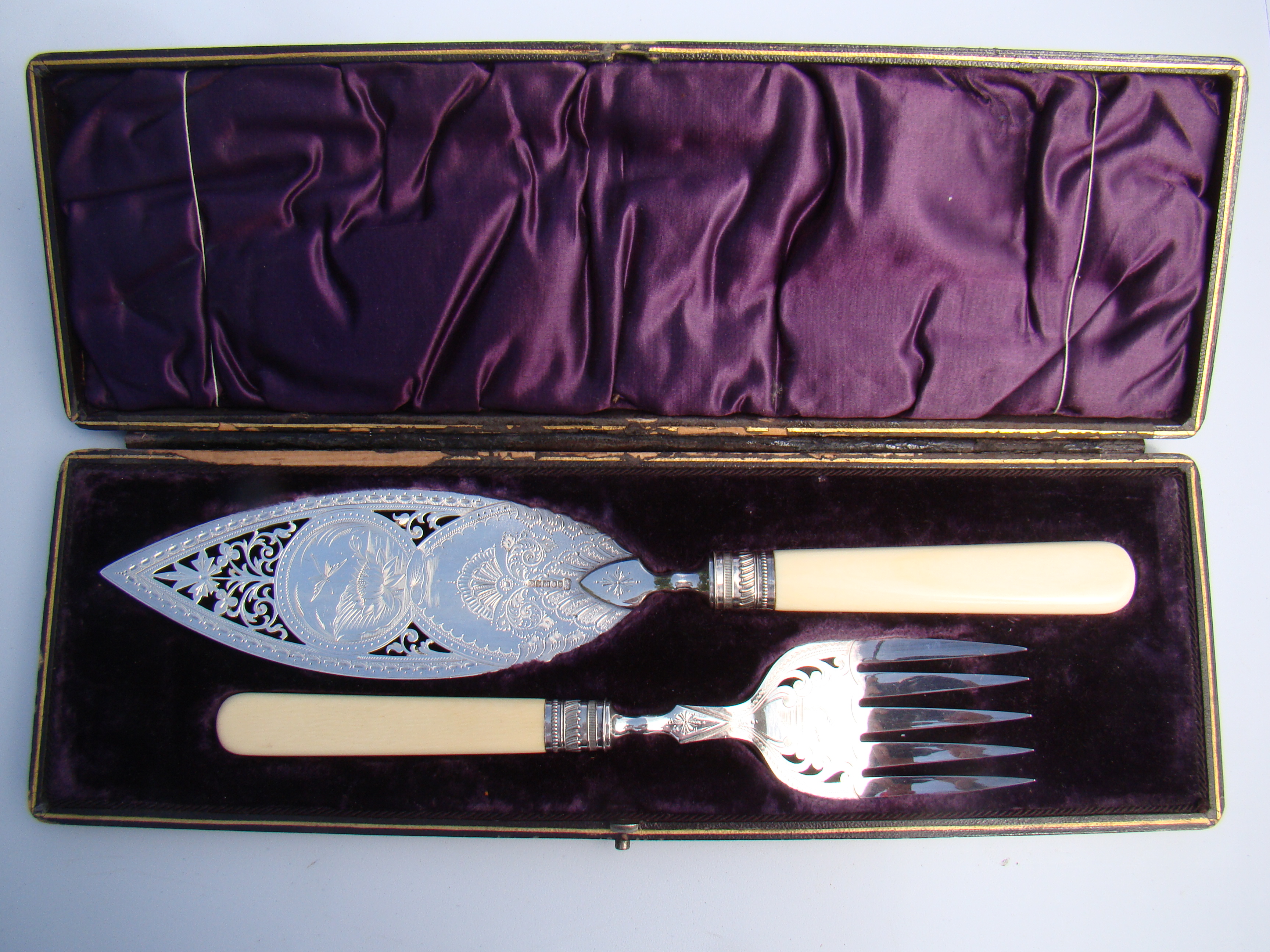 A beautiful antique set of ivory handled fish servers circa 1880