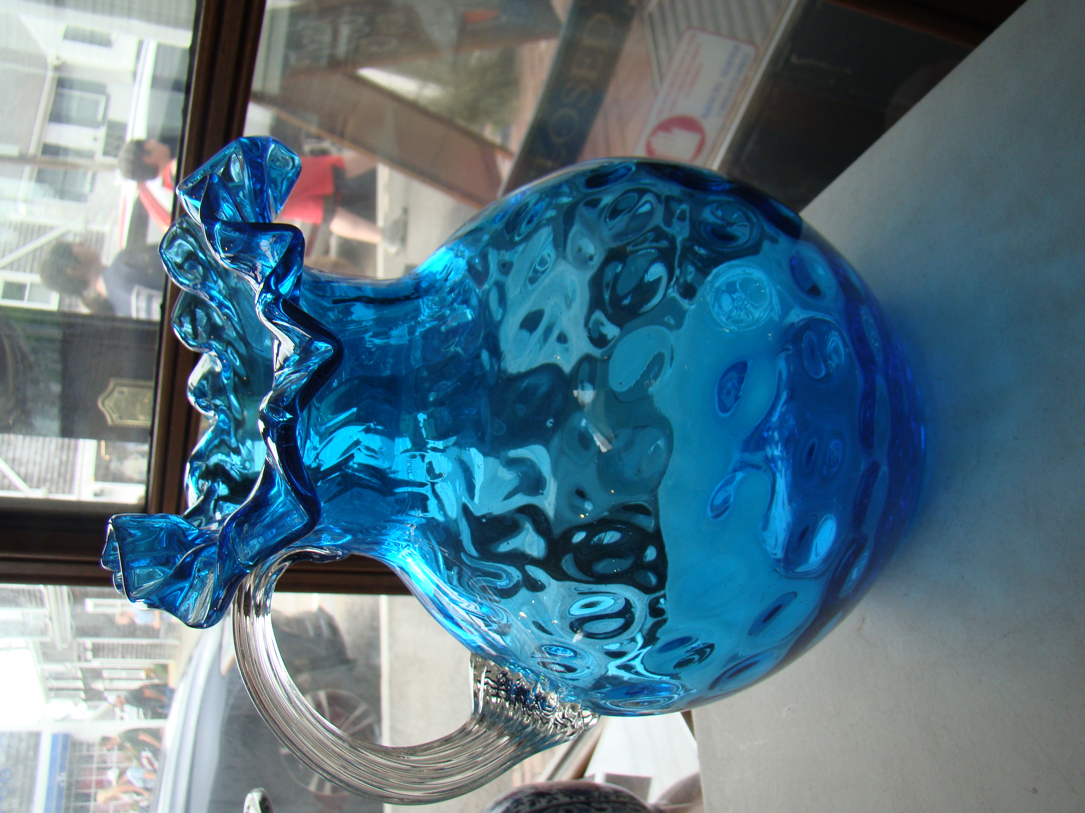 A beautiful vintage Fenton blue thumbprint pattern pitcher