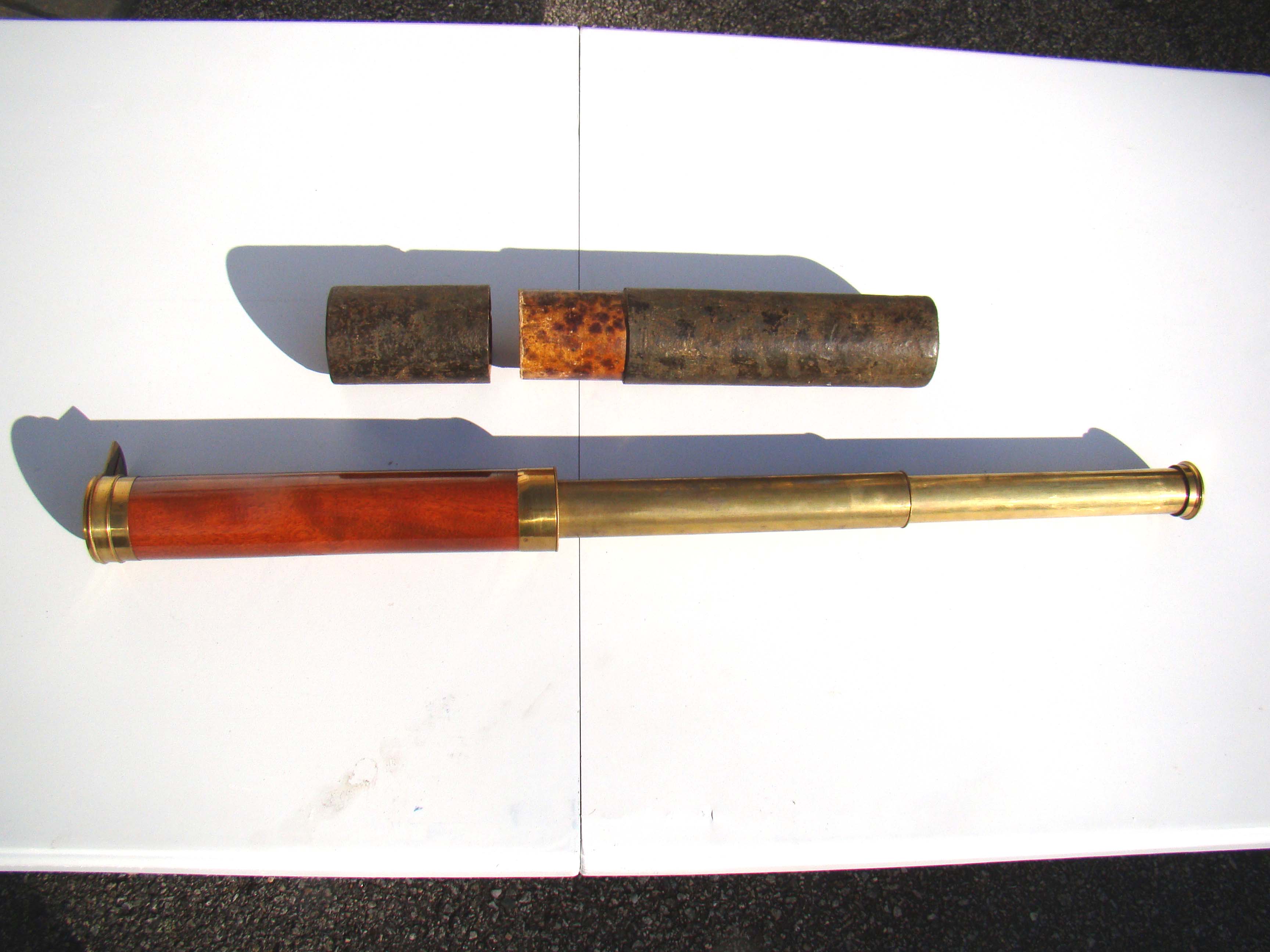 A beautiful early 19th century two-draw telescope with mahogany barrel and retaining its' original carrying case