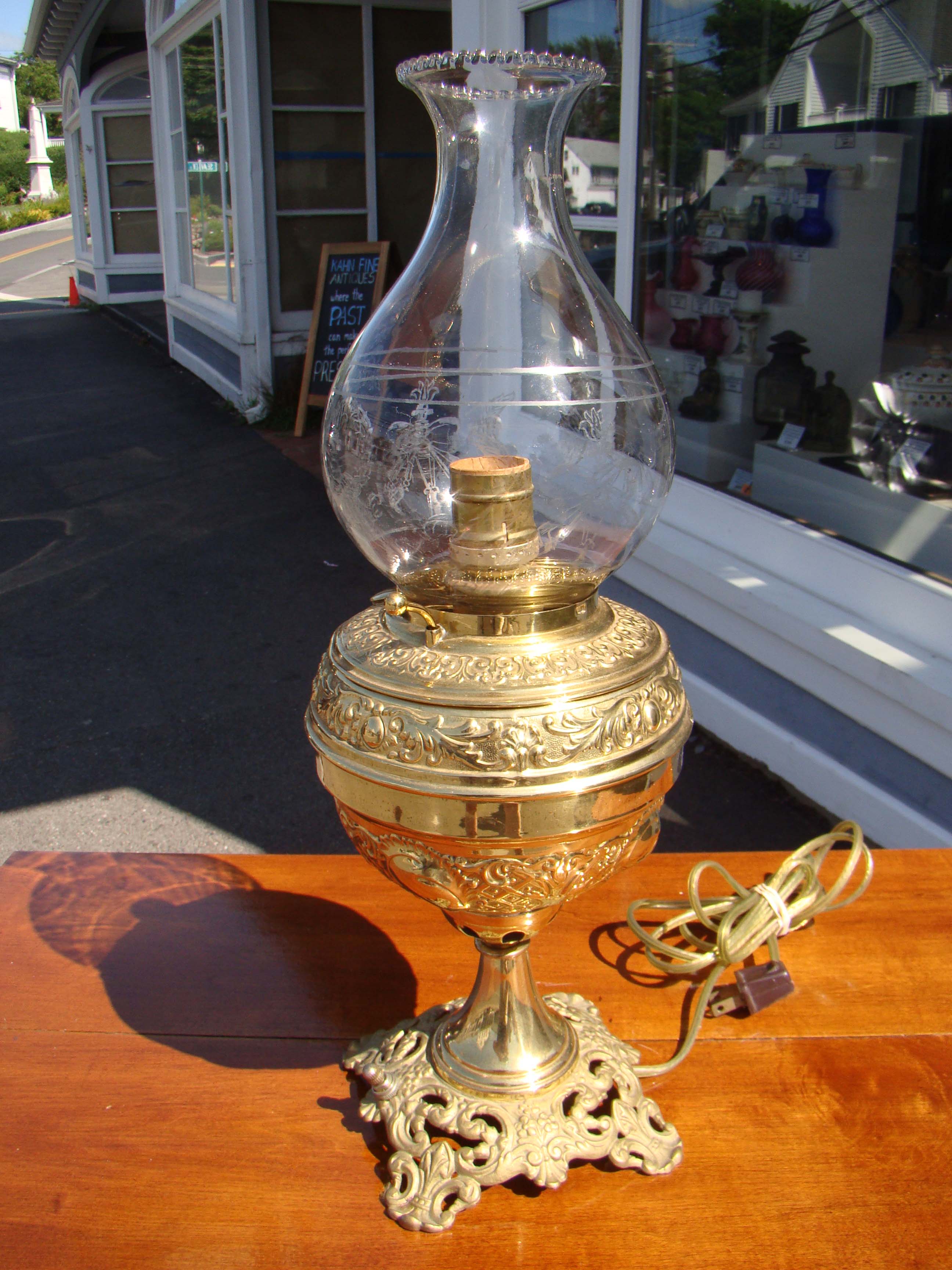 A beautiful 19th century oil lamp with etched glass hurricane circa 1885