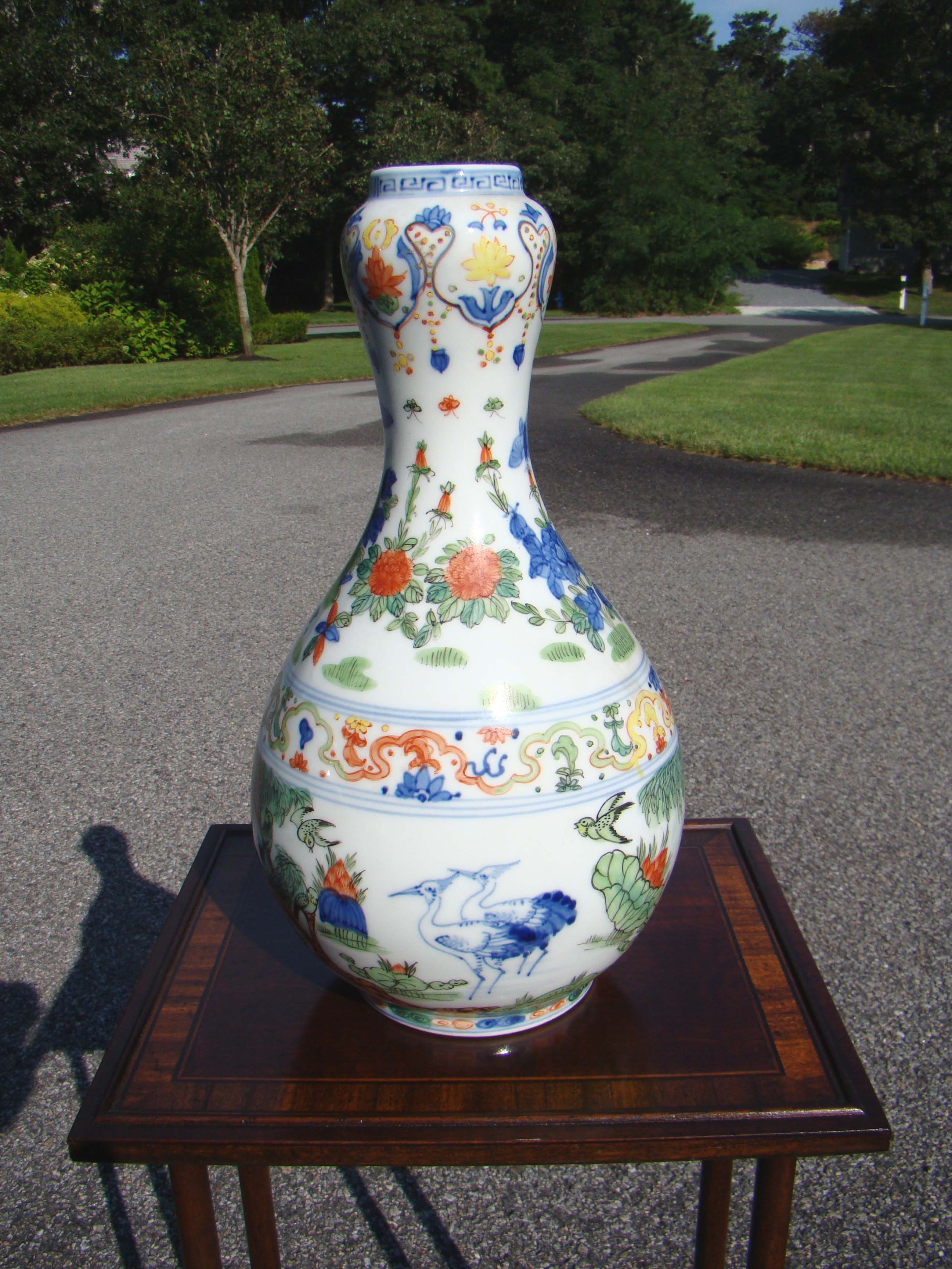 An attractive contemporary Chinese vase decorated with swallows, cranes, mandarin ducks, lotus and crickets