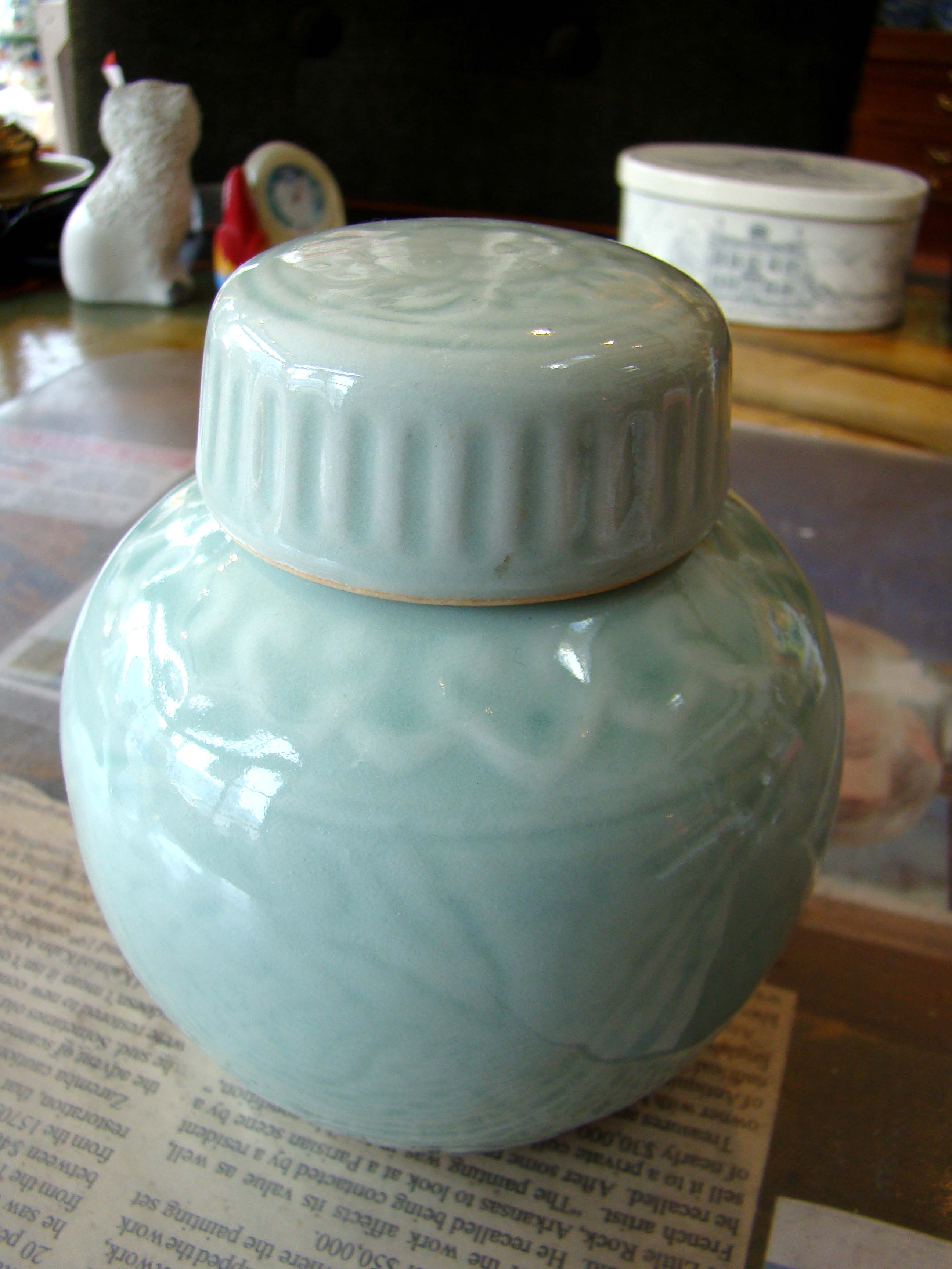 An attractive vintage Chinese celadon lotus pattern covered jar