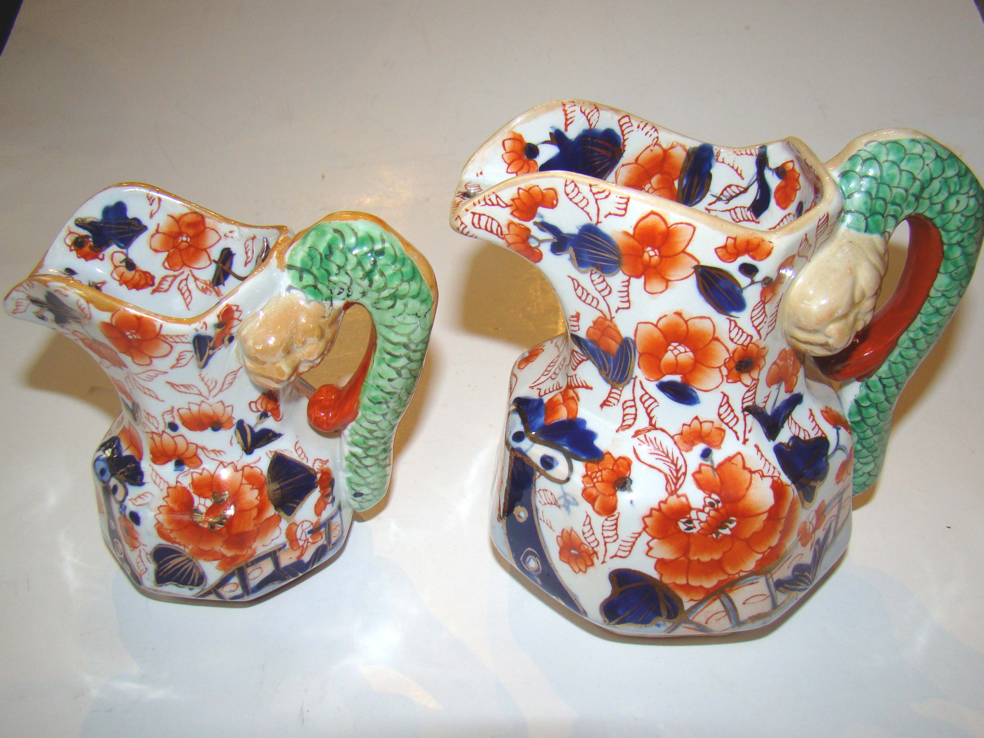 A beautiful pair of Mason's Ironstone Imari jugs with rare lion head serpent handles circa 1840