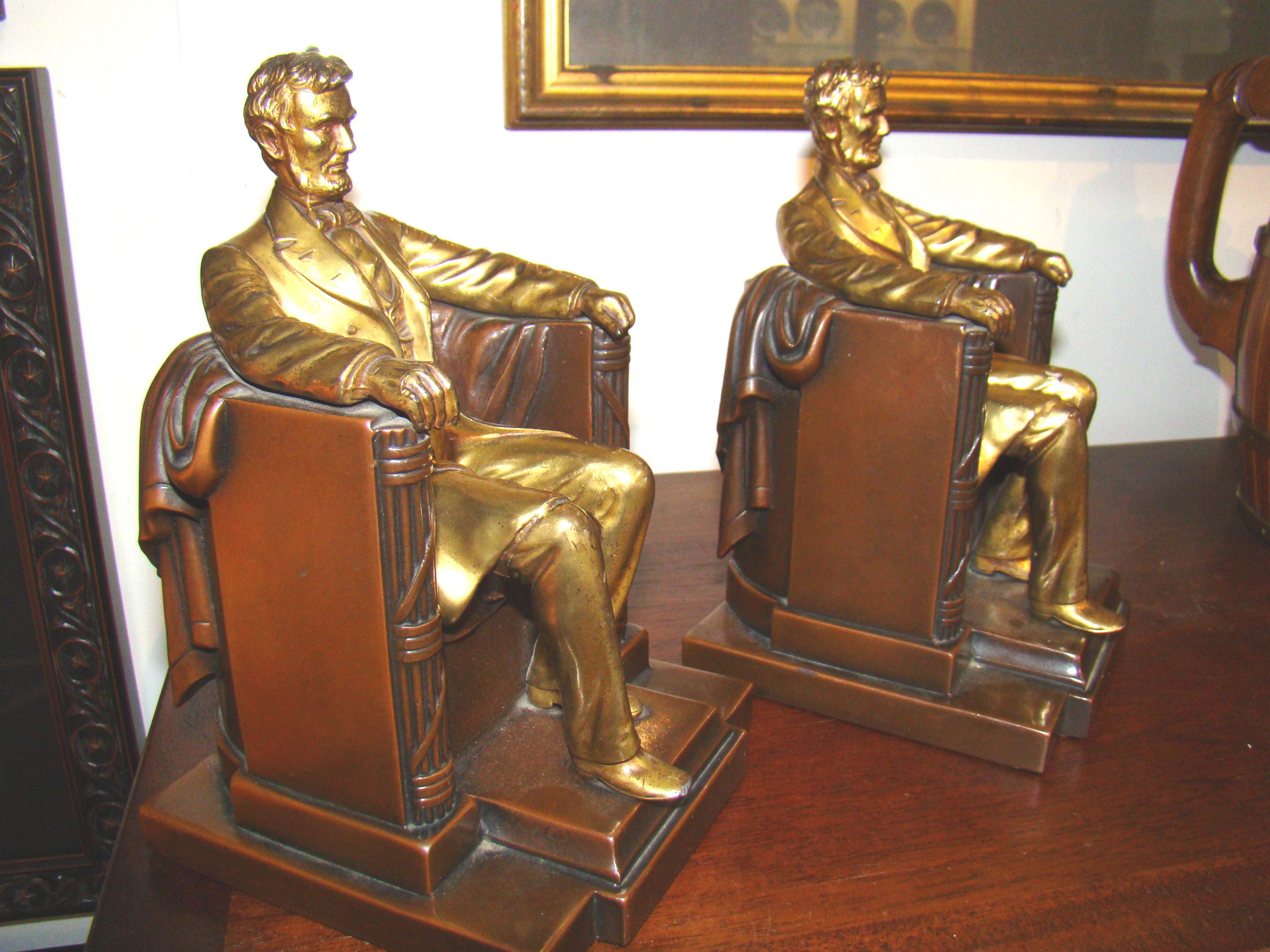 A good pair of vintage Abraham Lincoln 'sitting in the chair" bookends circa 1930