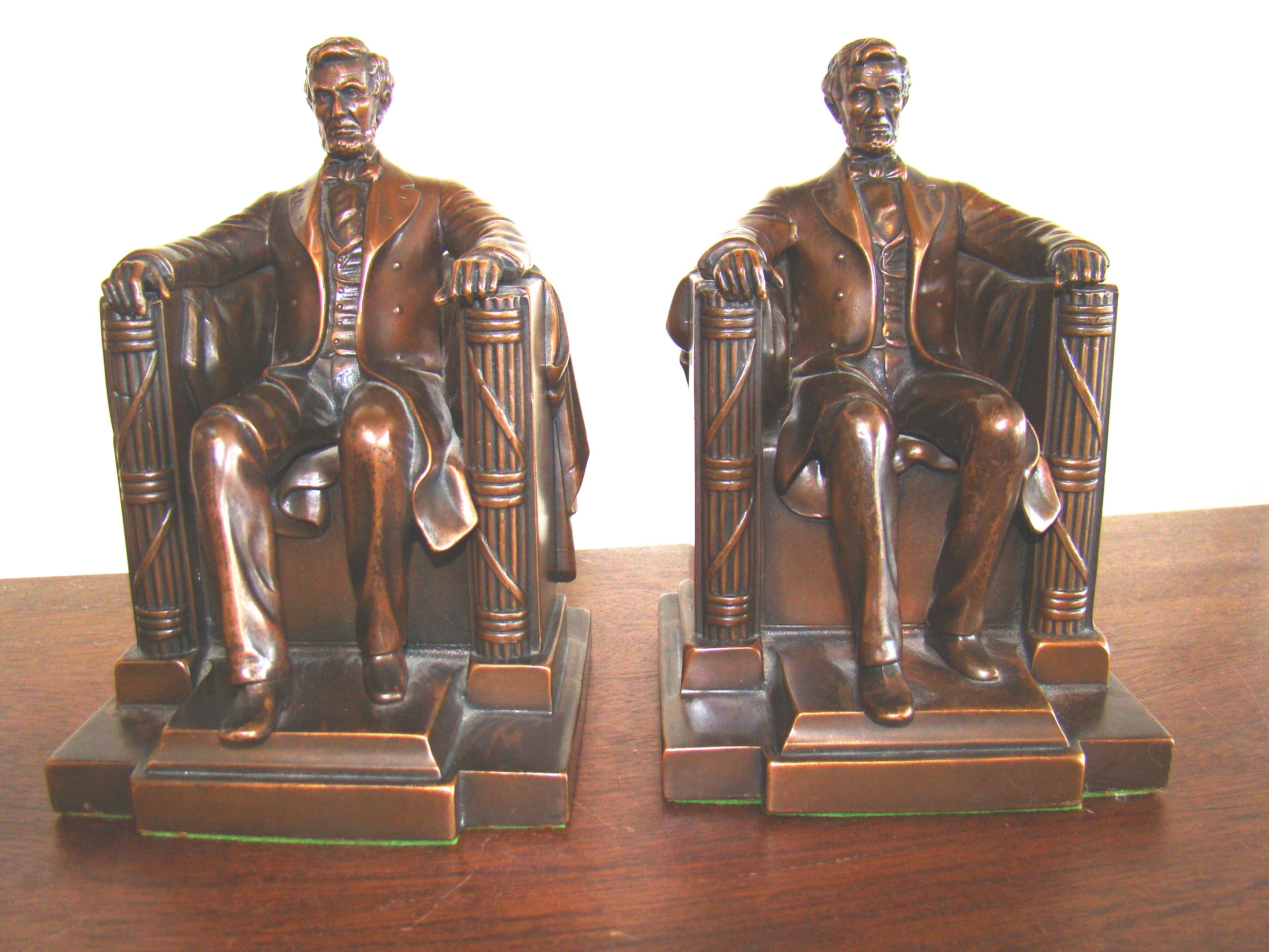 A gorgeous pair of chocolate brown, bronze Abraham Lincoln "sitting in the chair" bookends — image 2