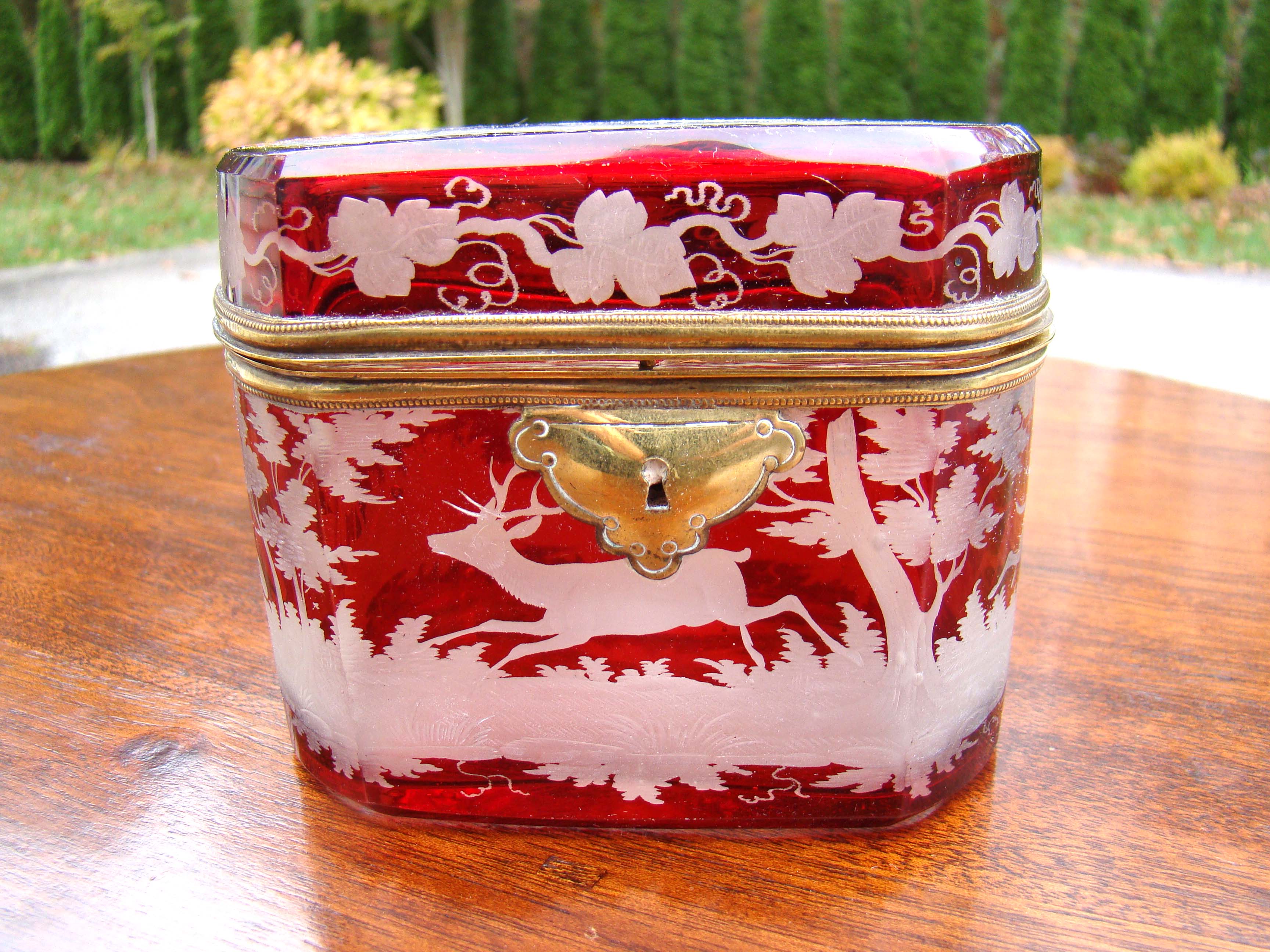 A extraordinary Bohemian ruby red cut to clear etched glass dresser box with gilt mounts circa 1870