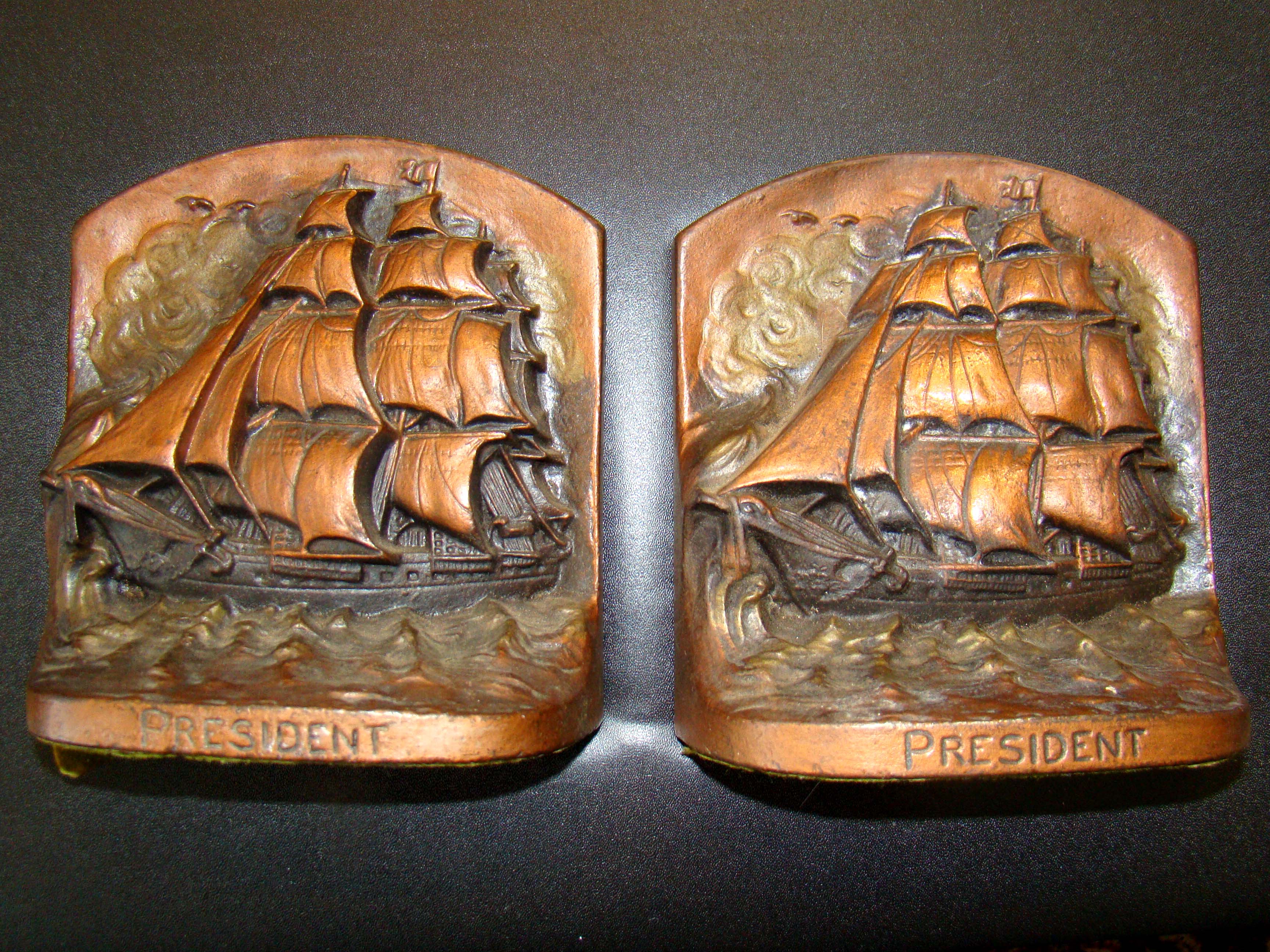 A pair of circa 1910 bookends depicting the ship "PRESIDENT," flagship of Commodore Stephen Decatur during the War of 1812