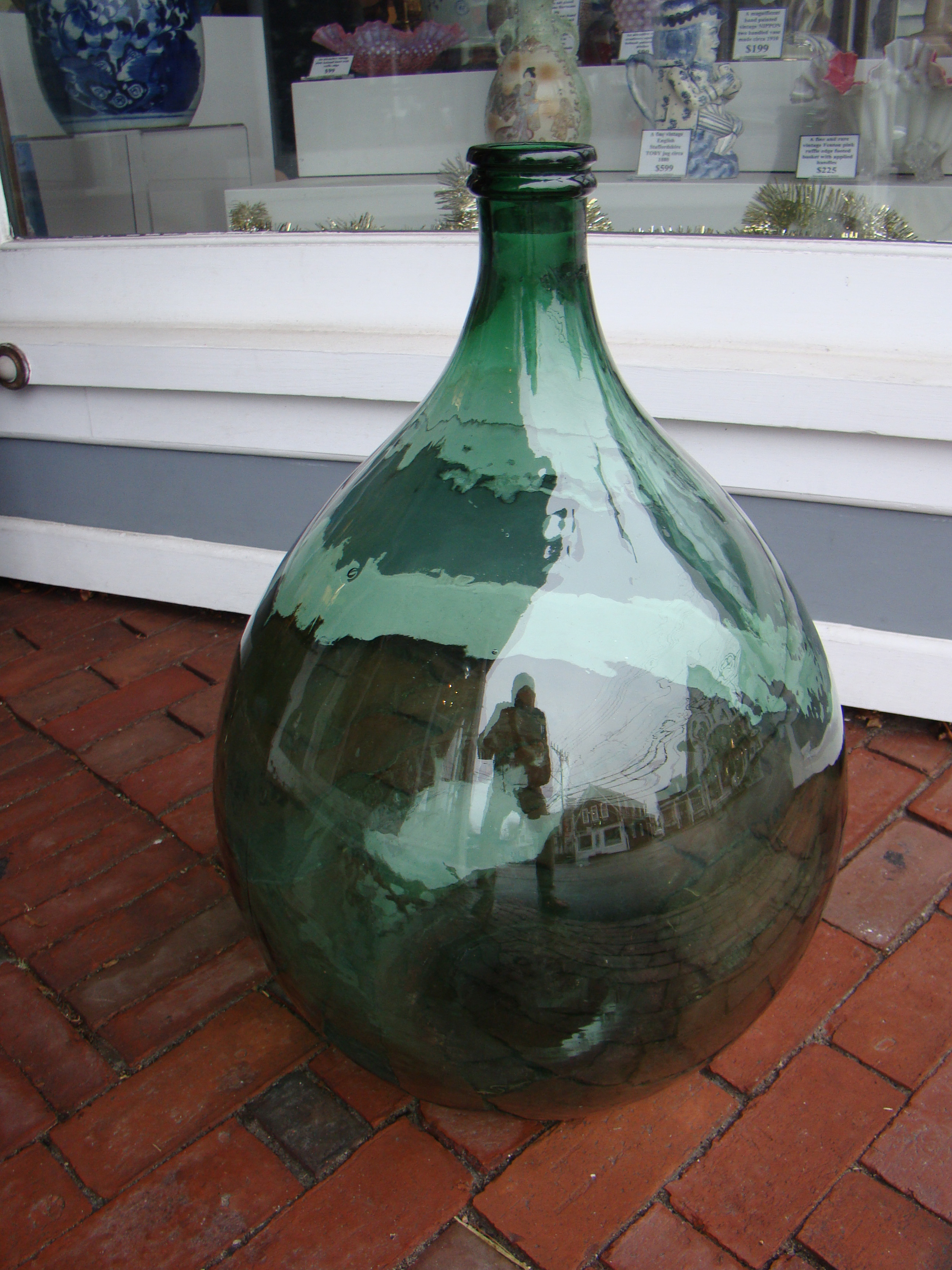 An attractive vintage Italian demijohn wine bottle