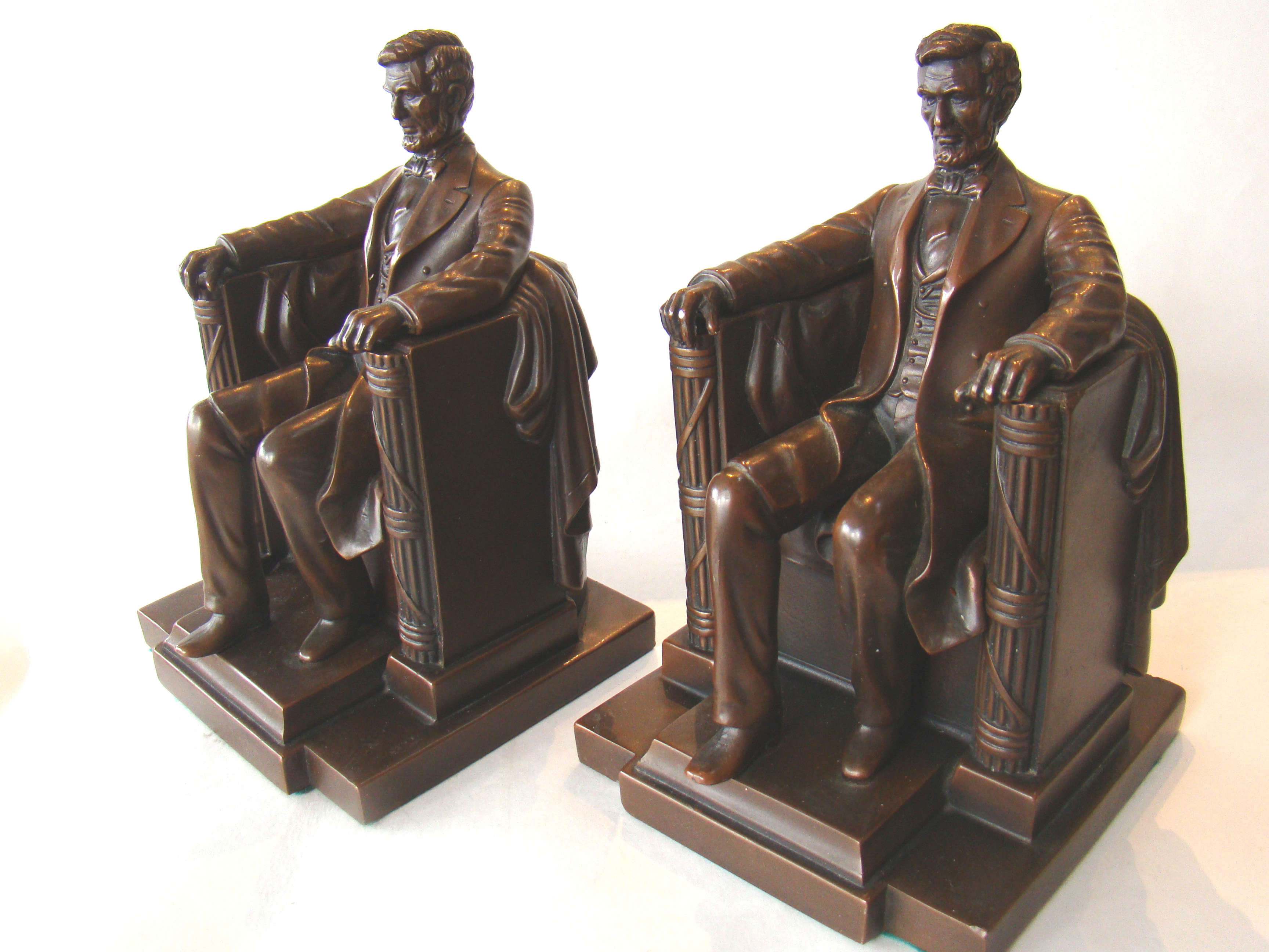 A fine pair of Abraham Lincoln "sitting in the chair" bronze finished bookends circa 1925