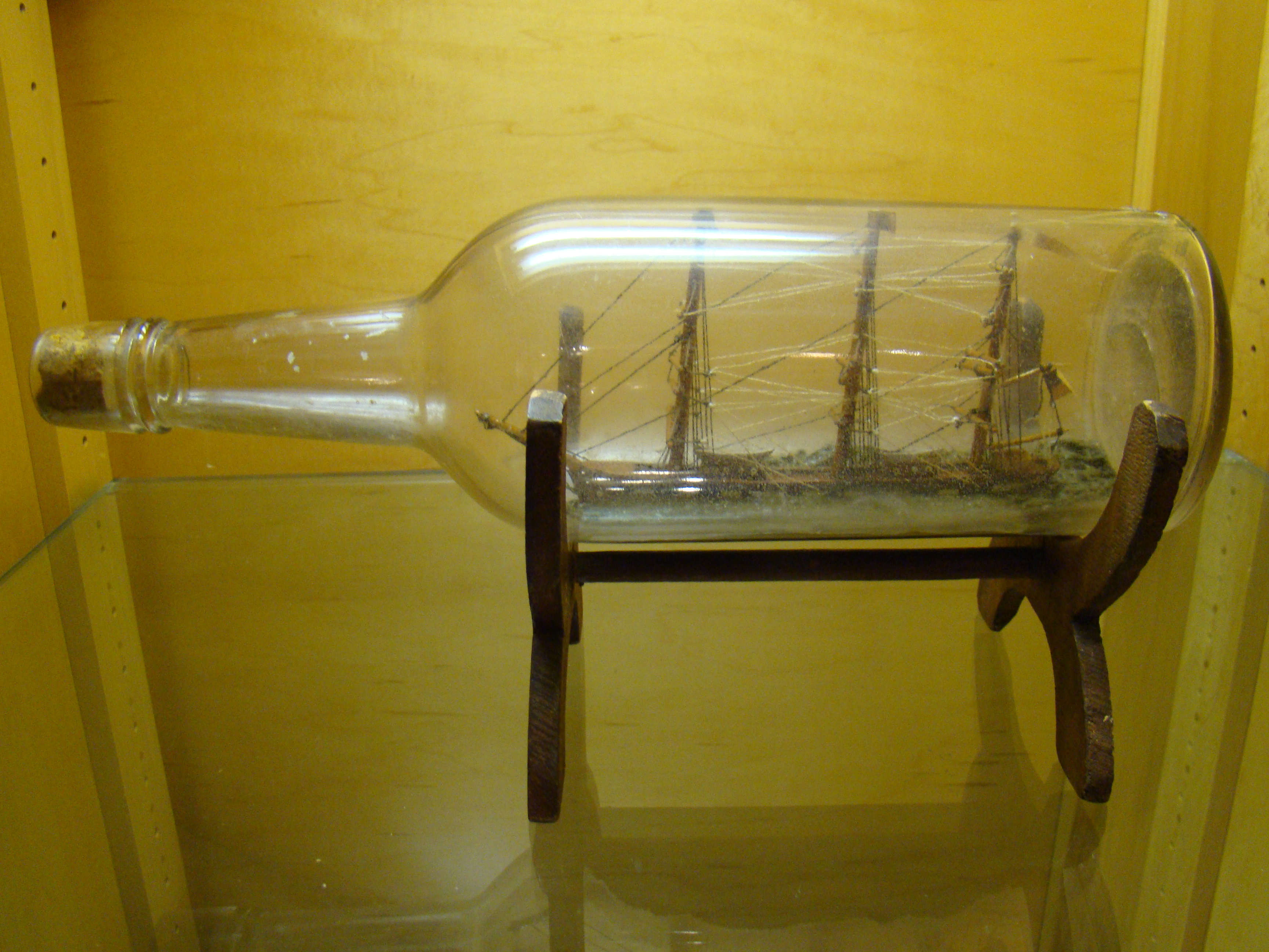 A late 19th century ship-in-a bottle flying an American flag circa 1890 — image 2