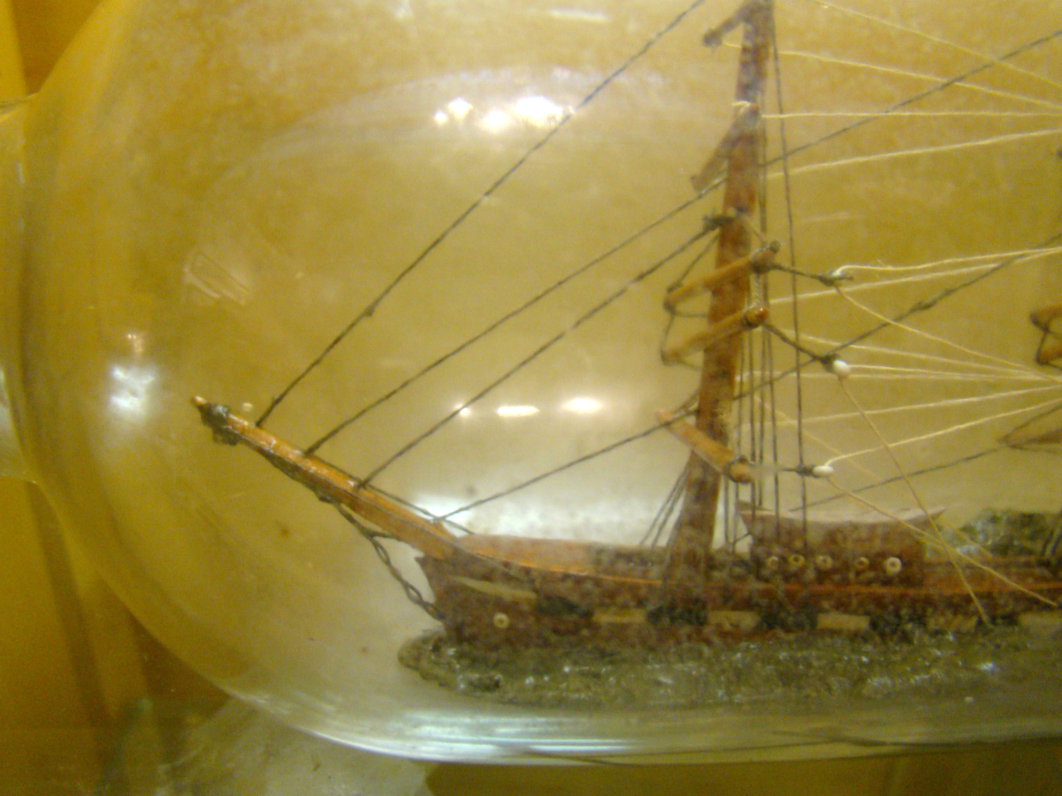 A late 19th century ship-in-a bottle flying an American flag circa 1890 — image 3