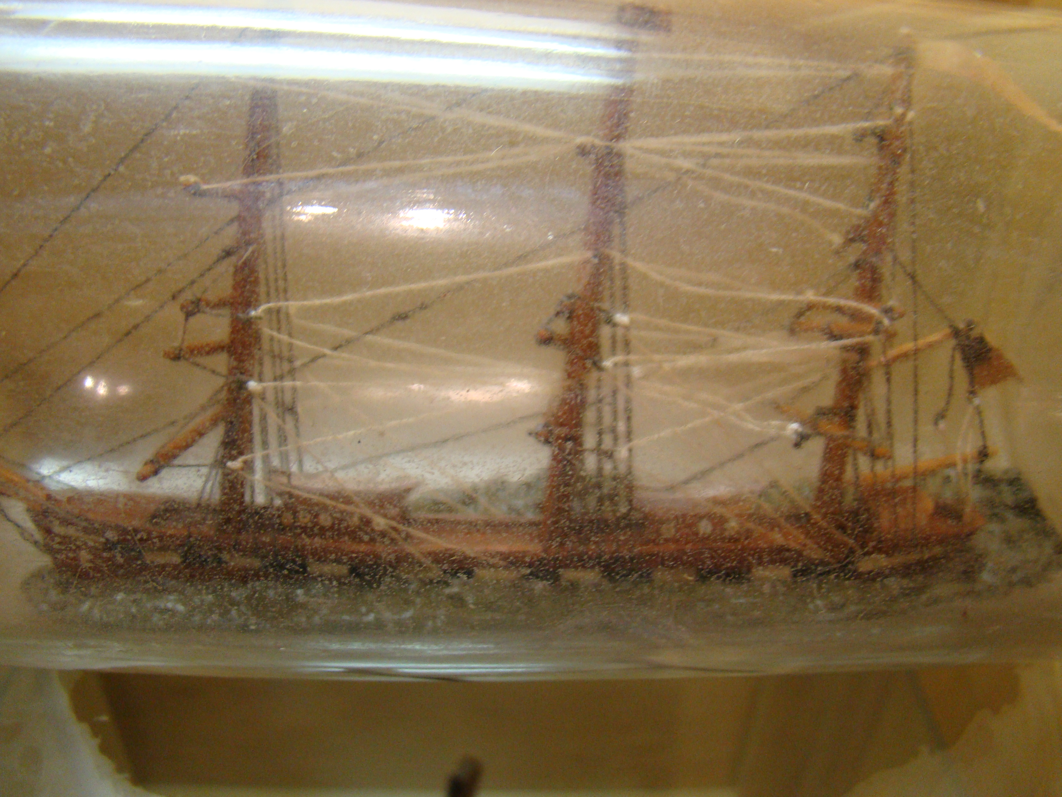 A late 19th century ship-in-a bottle flying an American flag circa 1890 — image 4