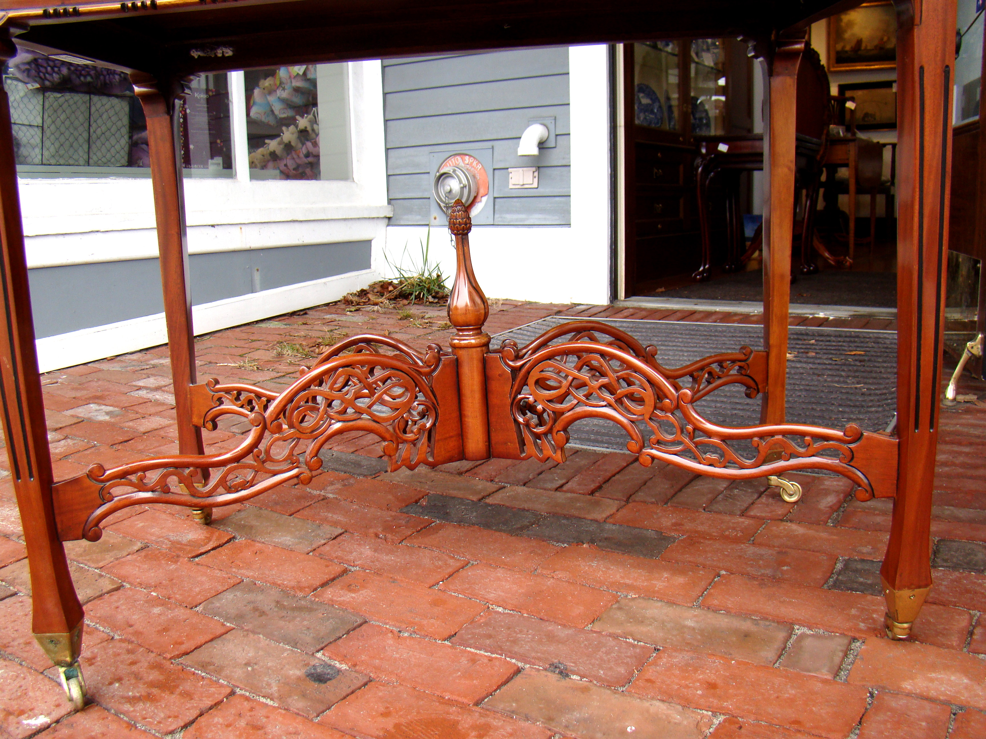 A fabulous mahogany galleried side table with ornate open-carved gallery and cross stretcher — image 3