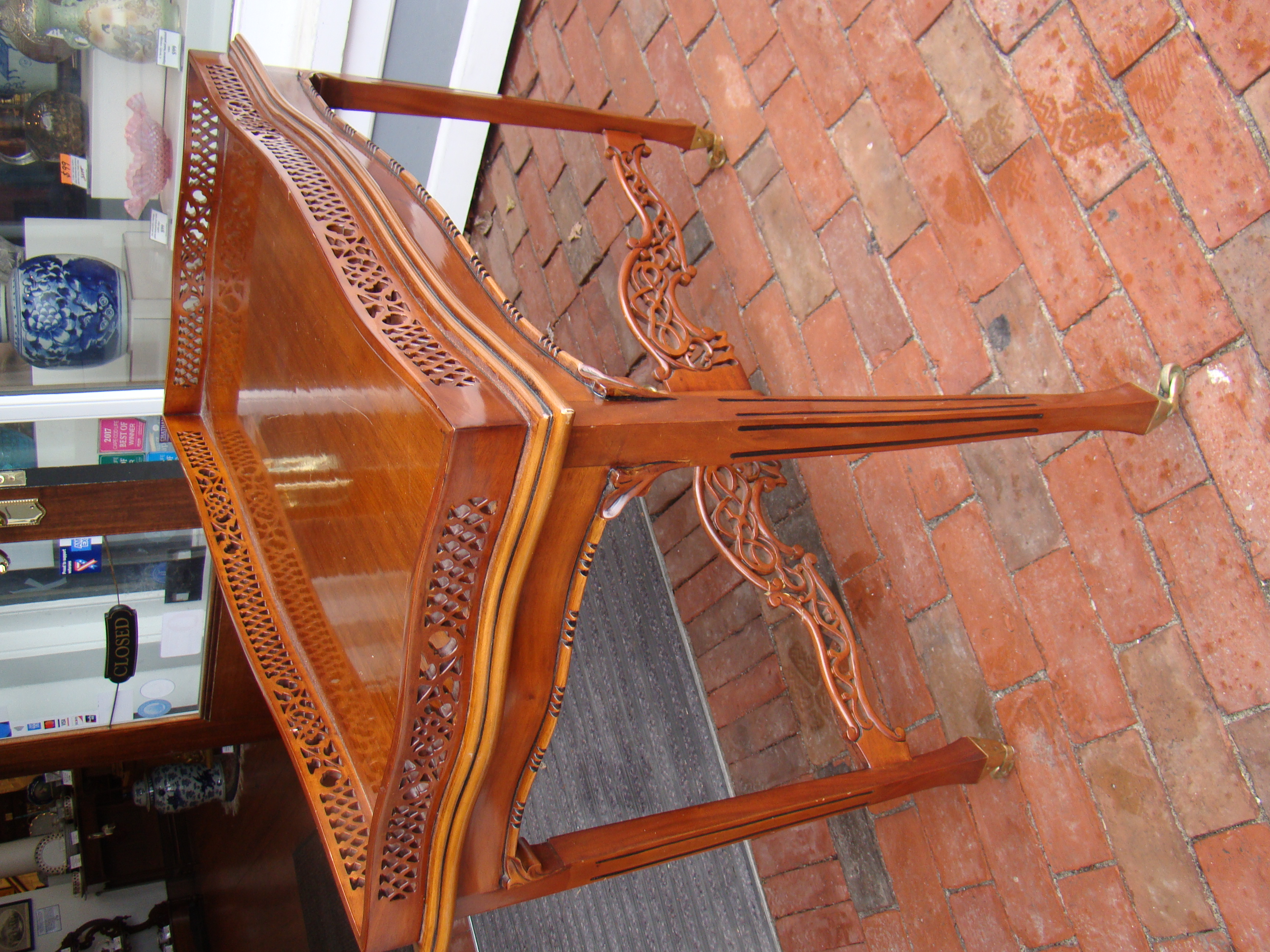 A fabulous mahogany galleried side table with ornate open-carved gallery and cross stretcher — image 2