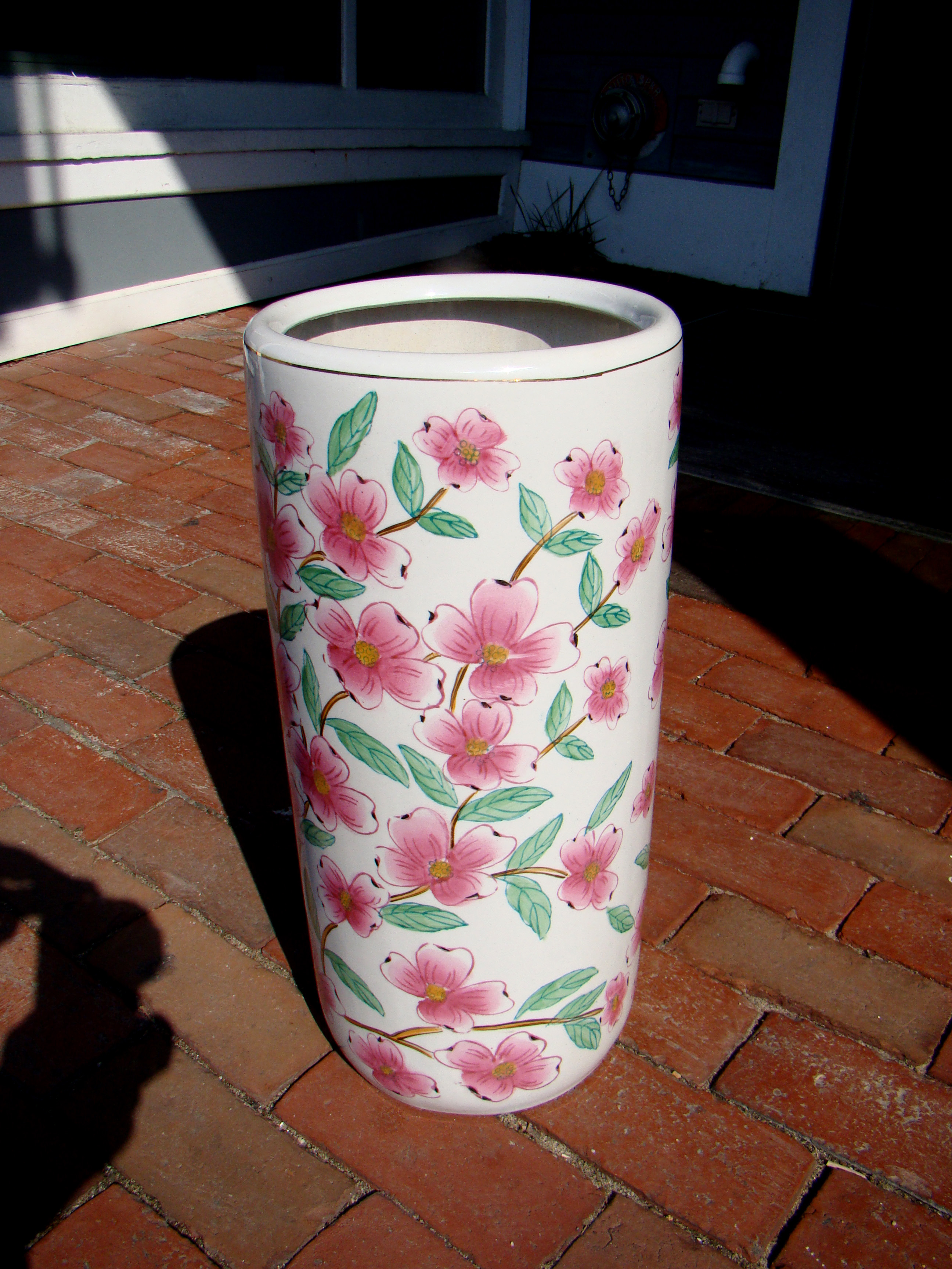 An attractive Chinese hand decorated 'pink dogwood' umbrella stand