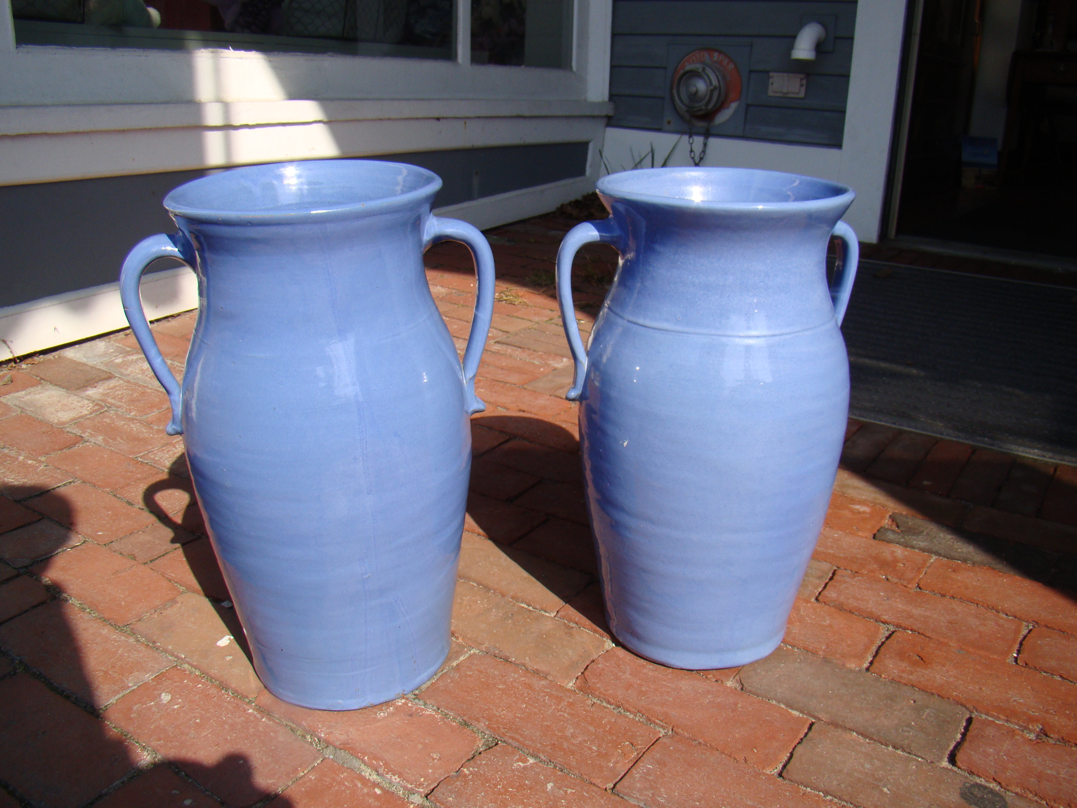A pair of vintage blue handled glazed pottery vases, probably circa 1930-1940