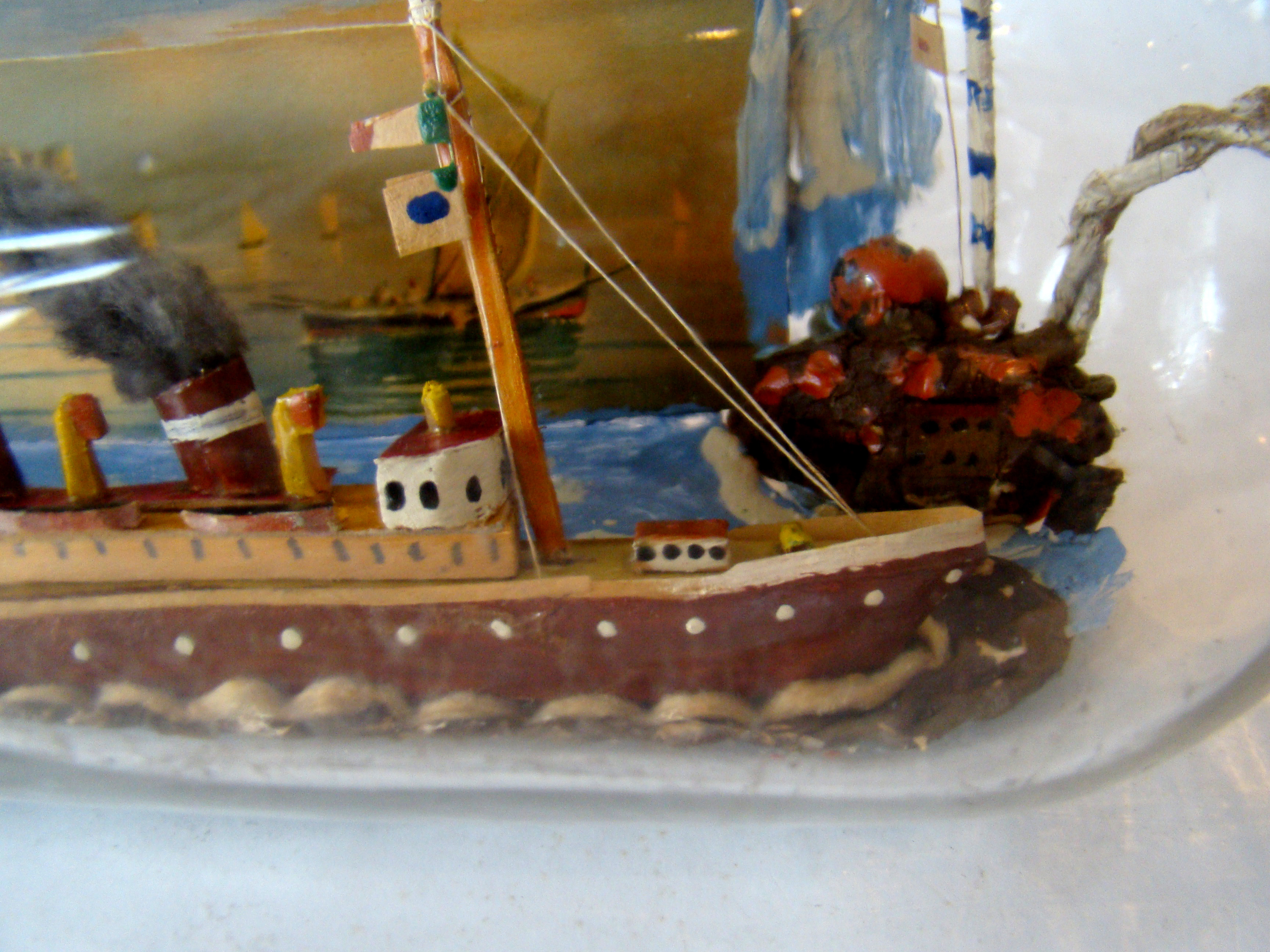 A fine vintage sailor-made two-funnel steam ship flying an American flag with village scene in the background — image 3