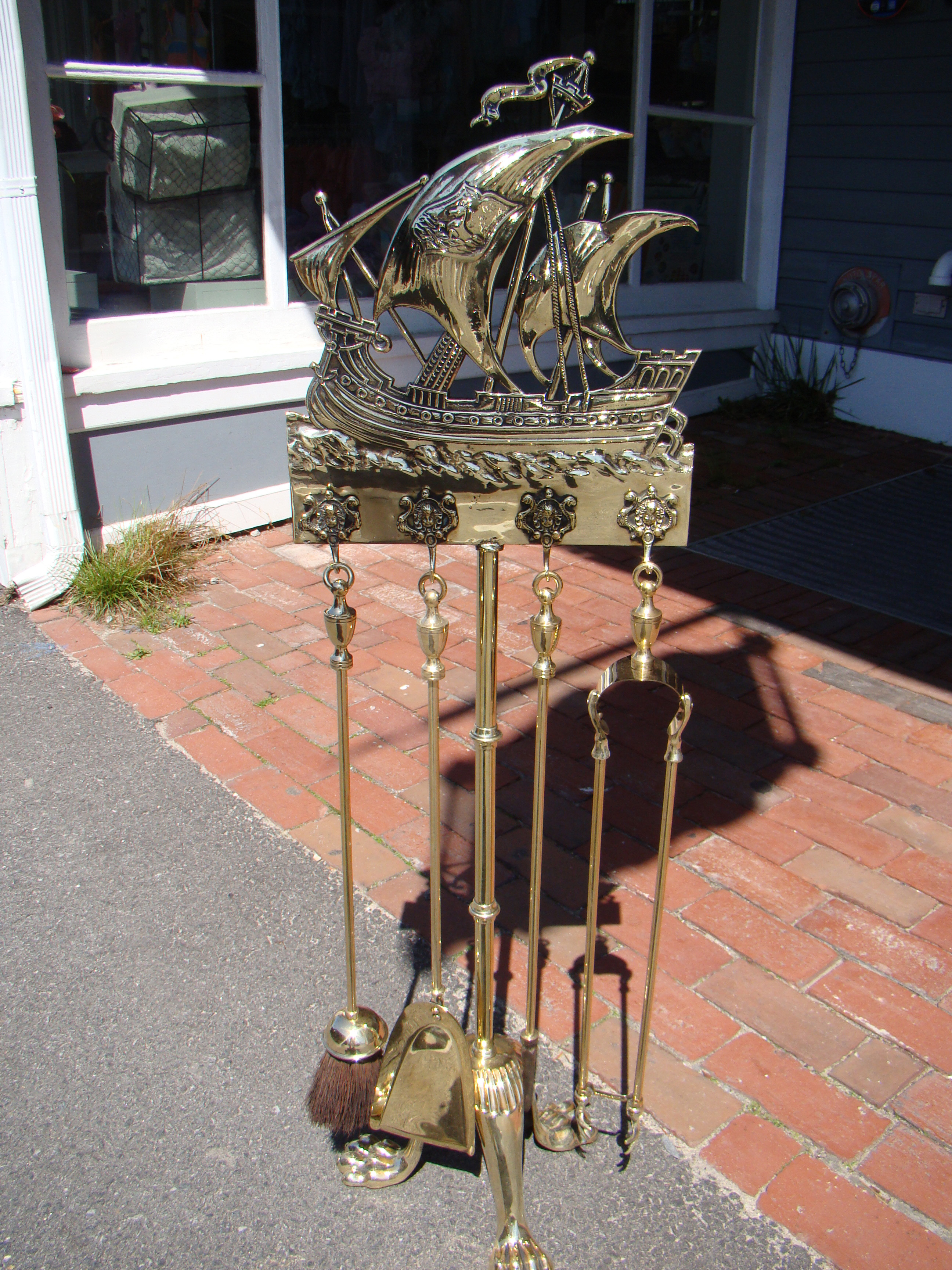 An outstanding nautical themed fire place equipment set circa 1900