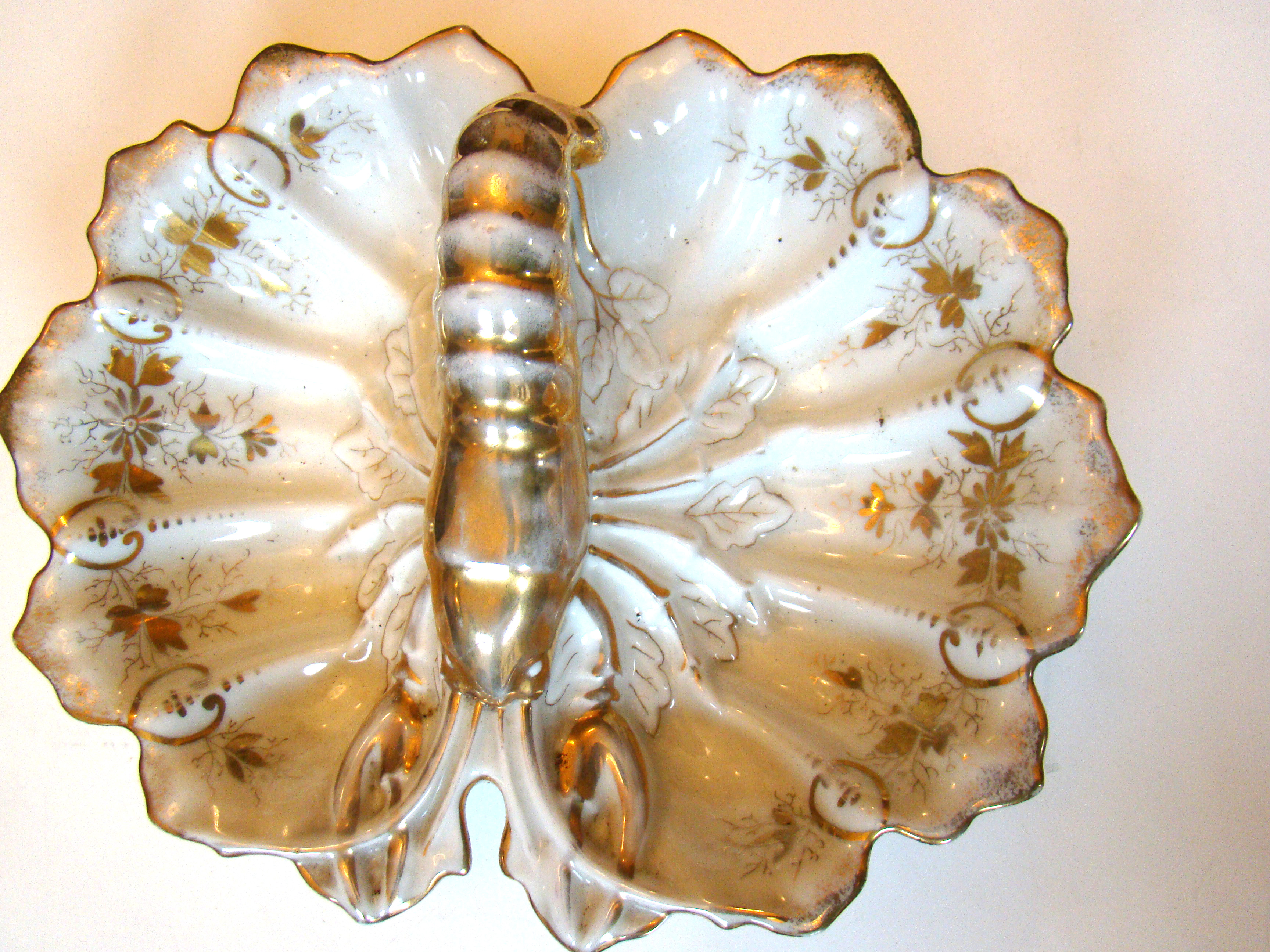 A charming vintage serving dish having a crawfish handle circa 1920