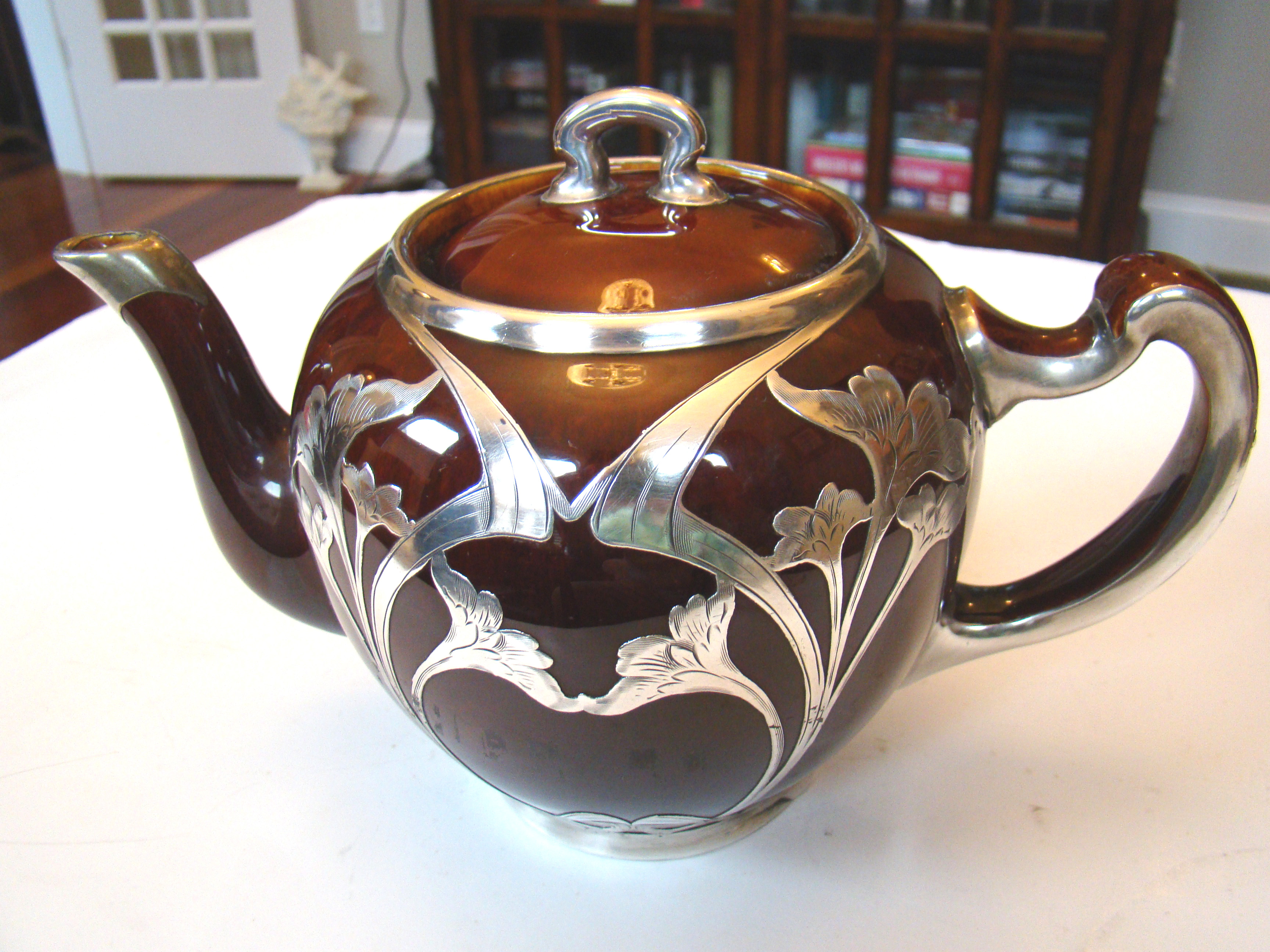 A beautiful vintage brown ceramic teapot with gorgeous silver overlay made by Lenox circa 1910
