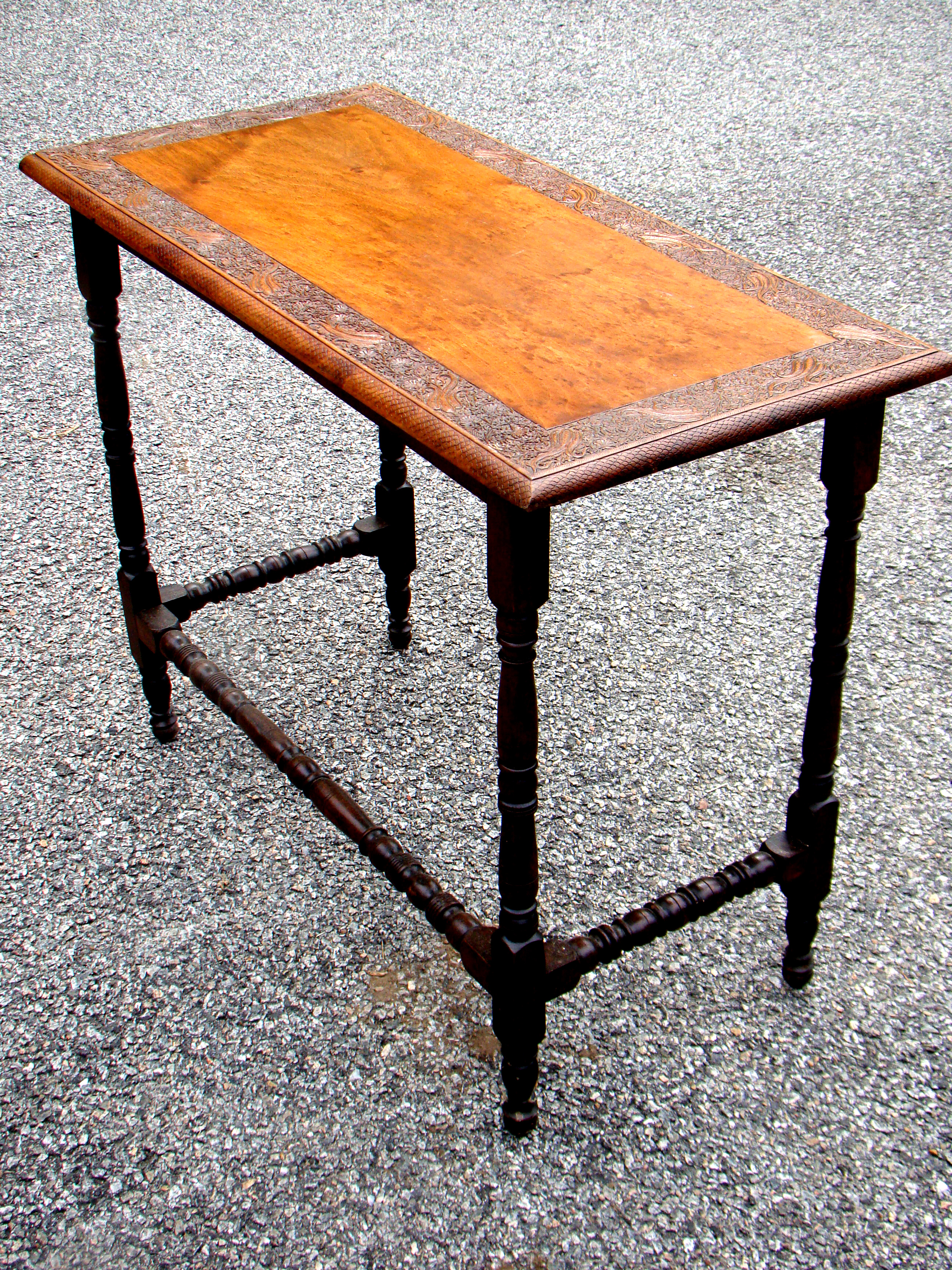 A beautifully carved American walnut side table circa 1890