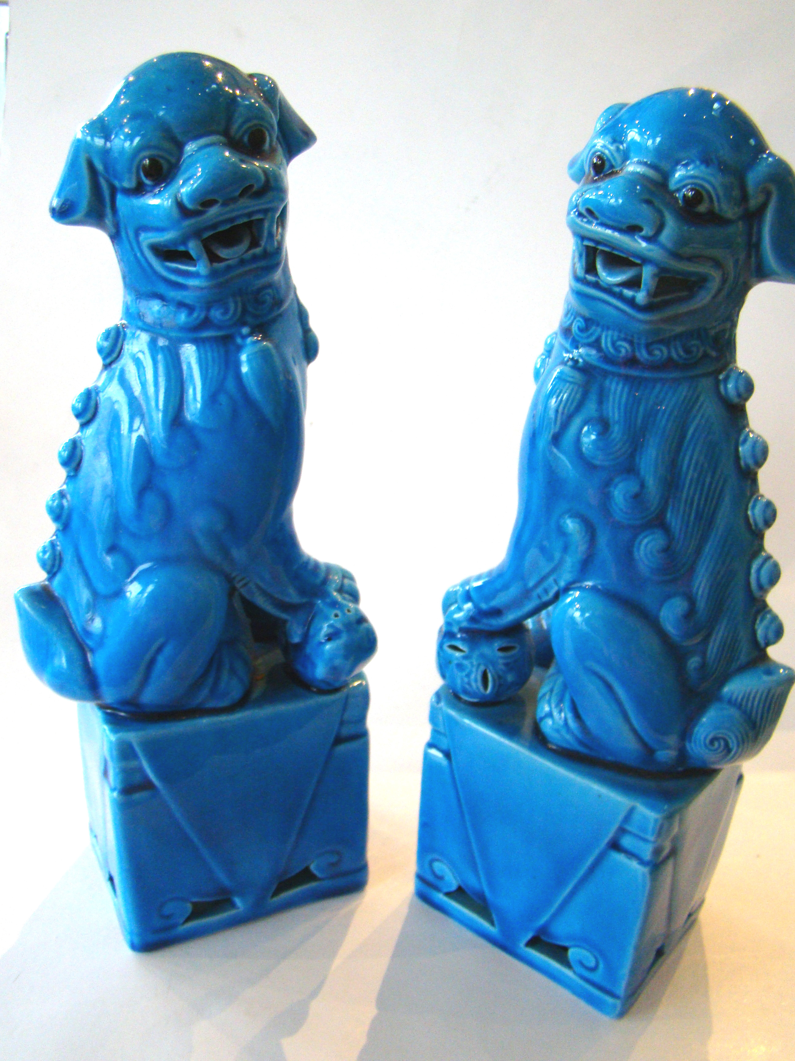 A beautiful pair of Chinese turquoise glazed Foo Dogs