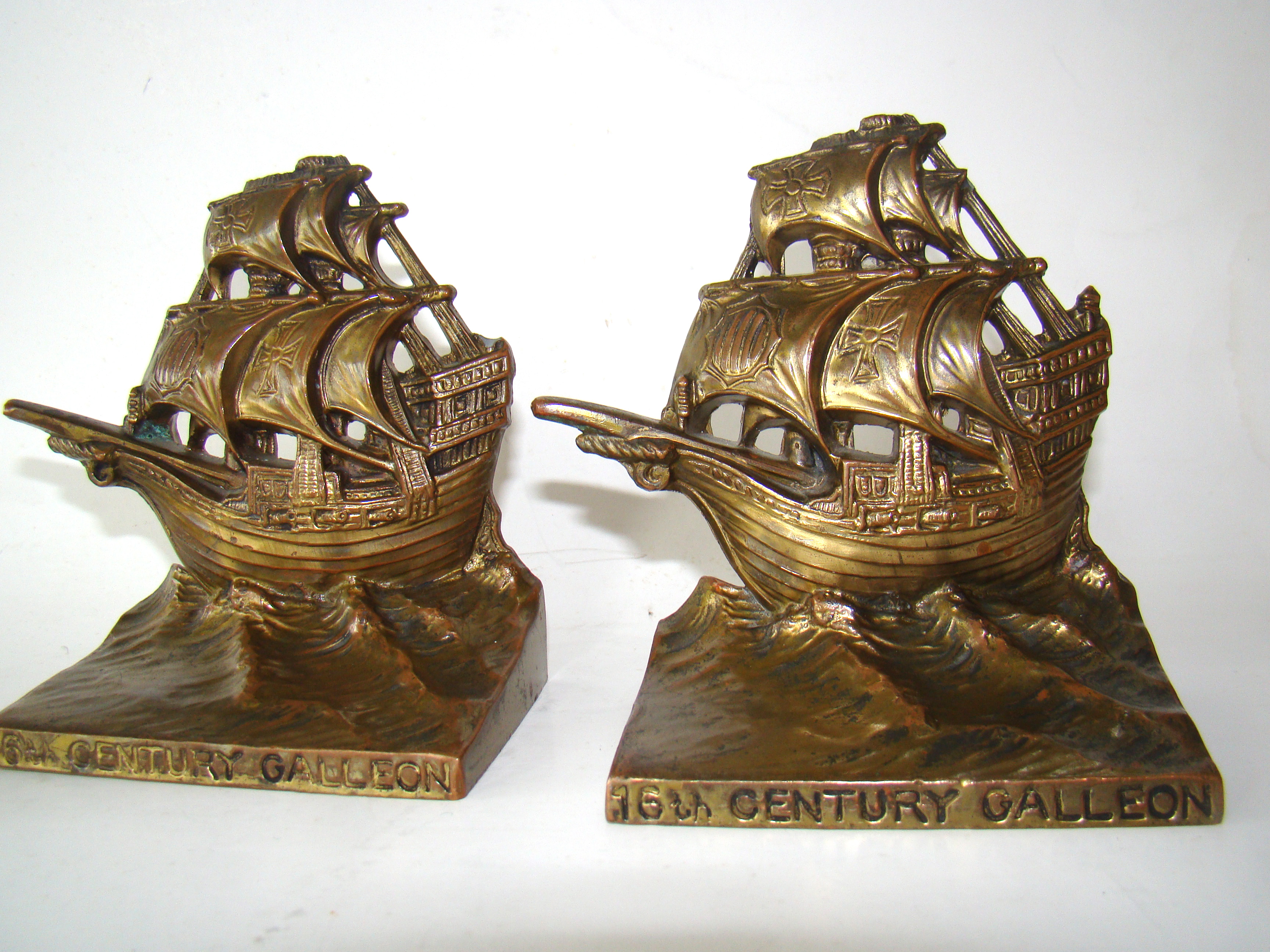 A FINE PAIR OF VINTAGE BOOKENDS DEPICTING A 16TH CENTURY GALLEON