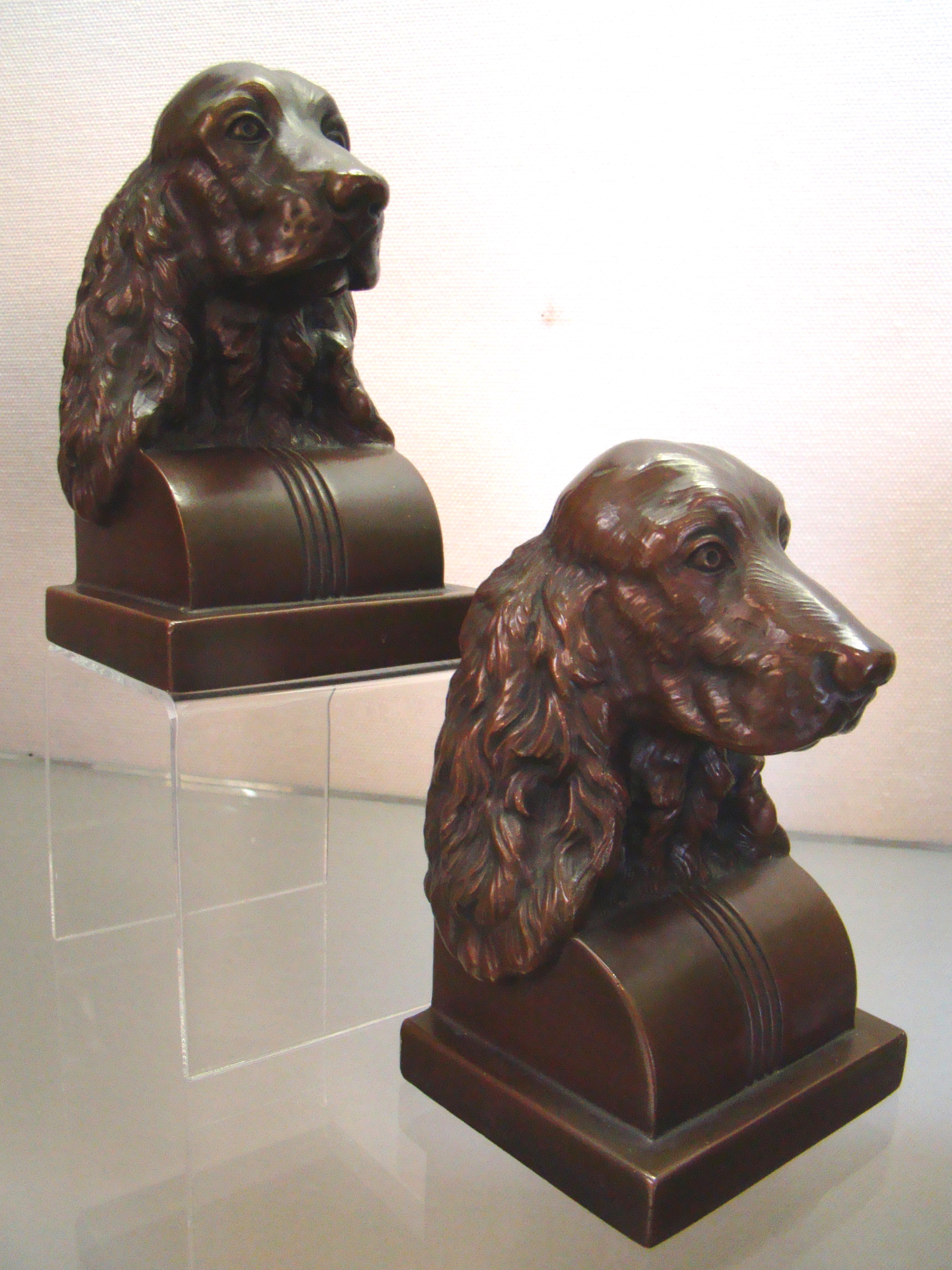 A charming pair of chocolate brown bronze finished COCKER SPANIEL bookends circa 1930