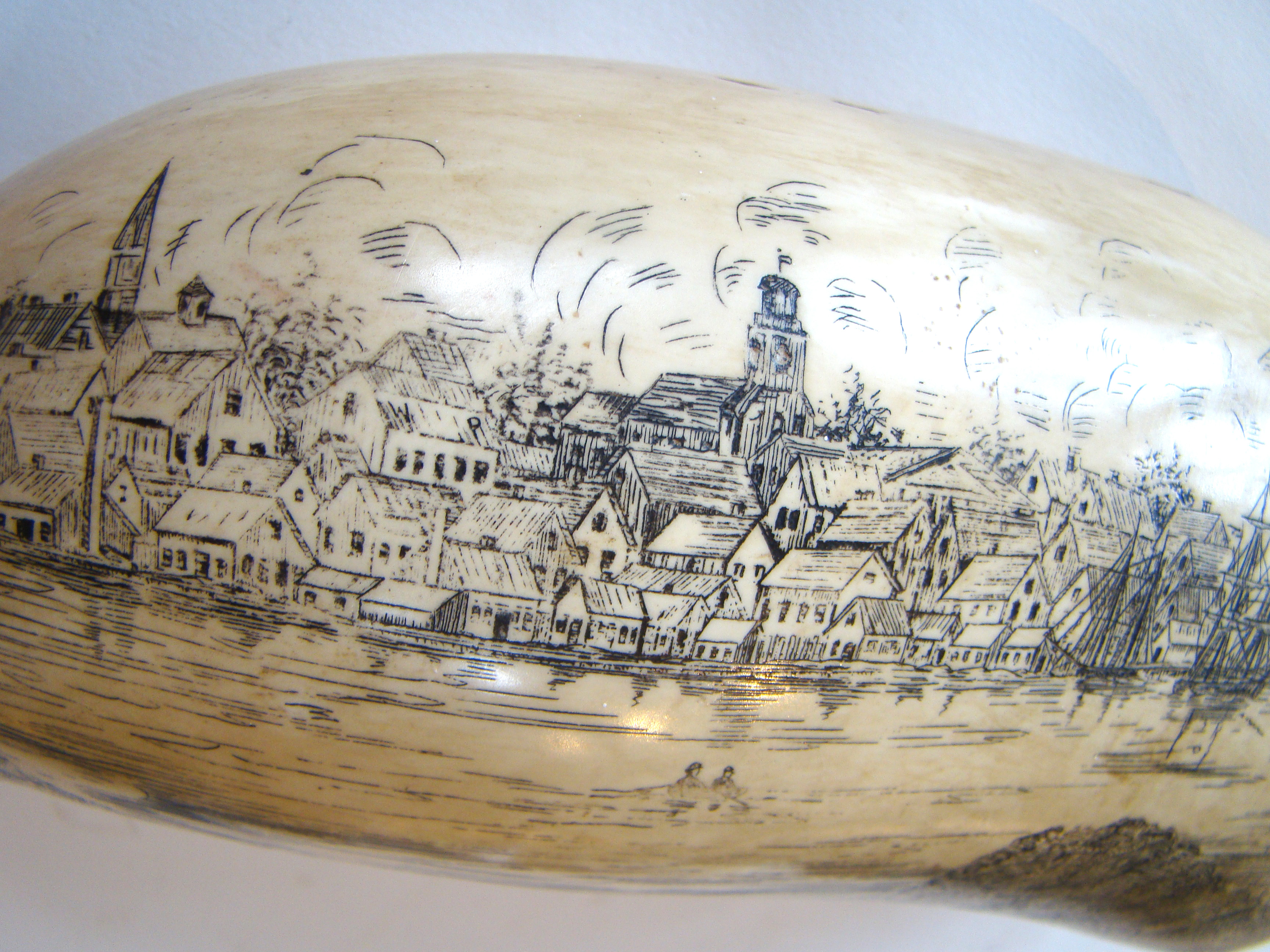 A FABULOUS, probably faux, scrimshaw whales tooth, depicting "A View of Nantucket, 1853" — image 3