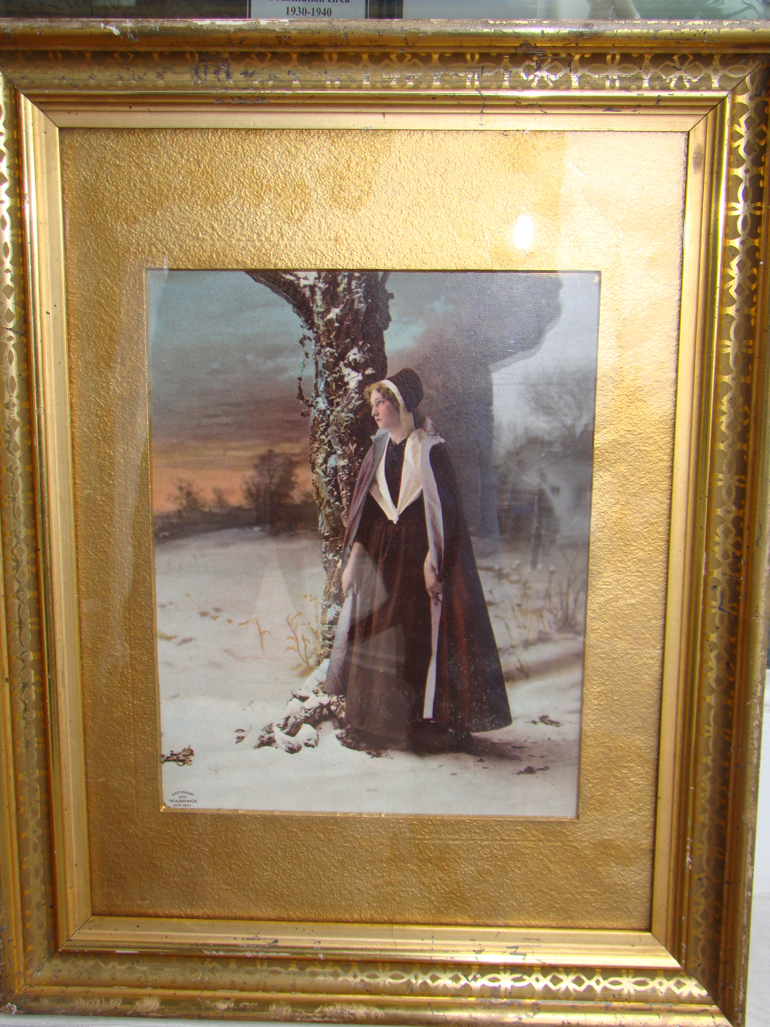 A framed 'photo' print of Hester Prynne dated 1896 from Nathaniel Hawthorne's "The Scarlet Letter" published in 1850