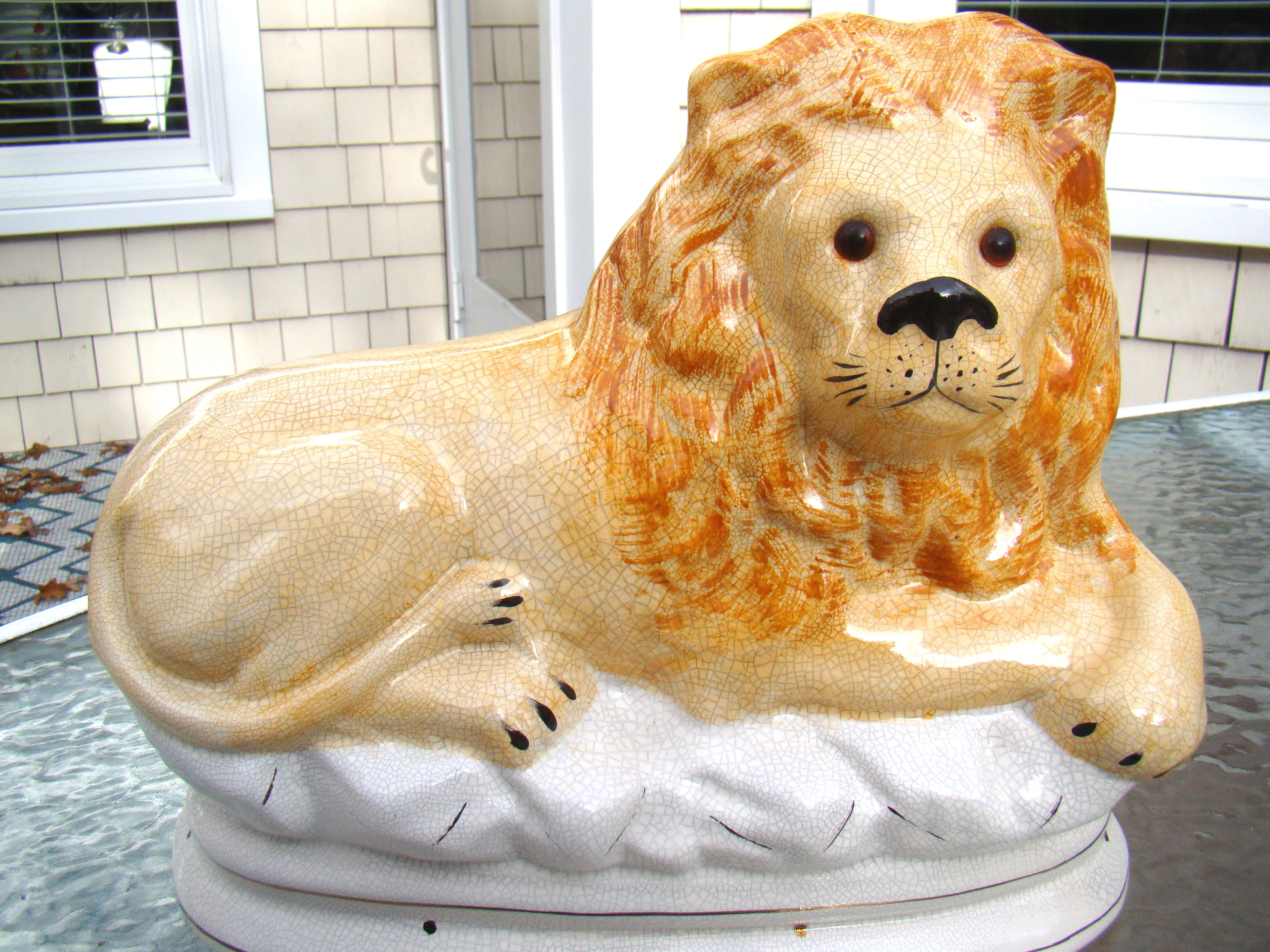 A fine pair of 19th century English Staffordshire glazed lions with glass eyes — image 2