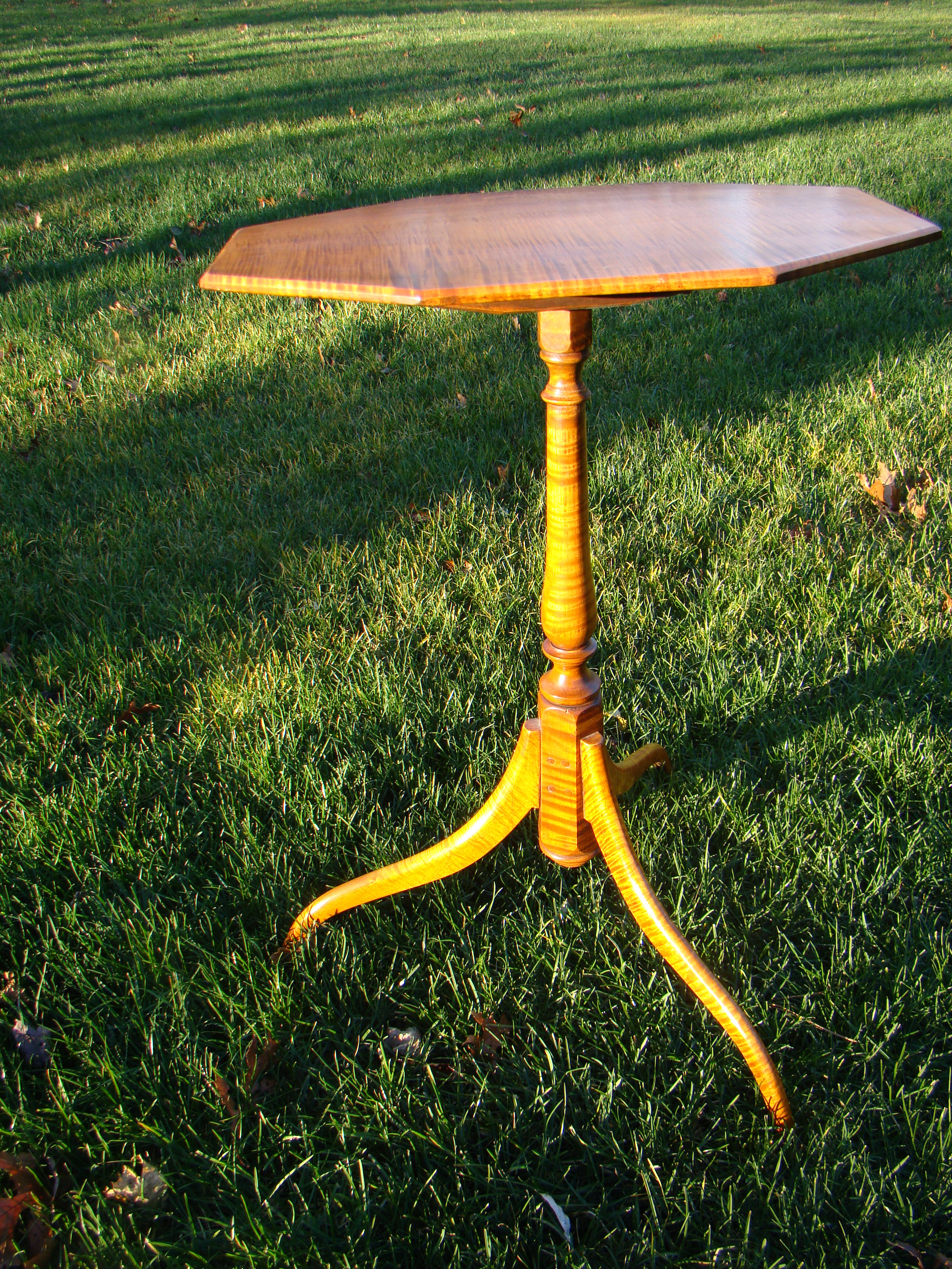 A RARE and beautiful Eldred Wheeler "Prototype" Dunlap style tilt-top tiger maple candlestand