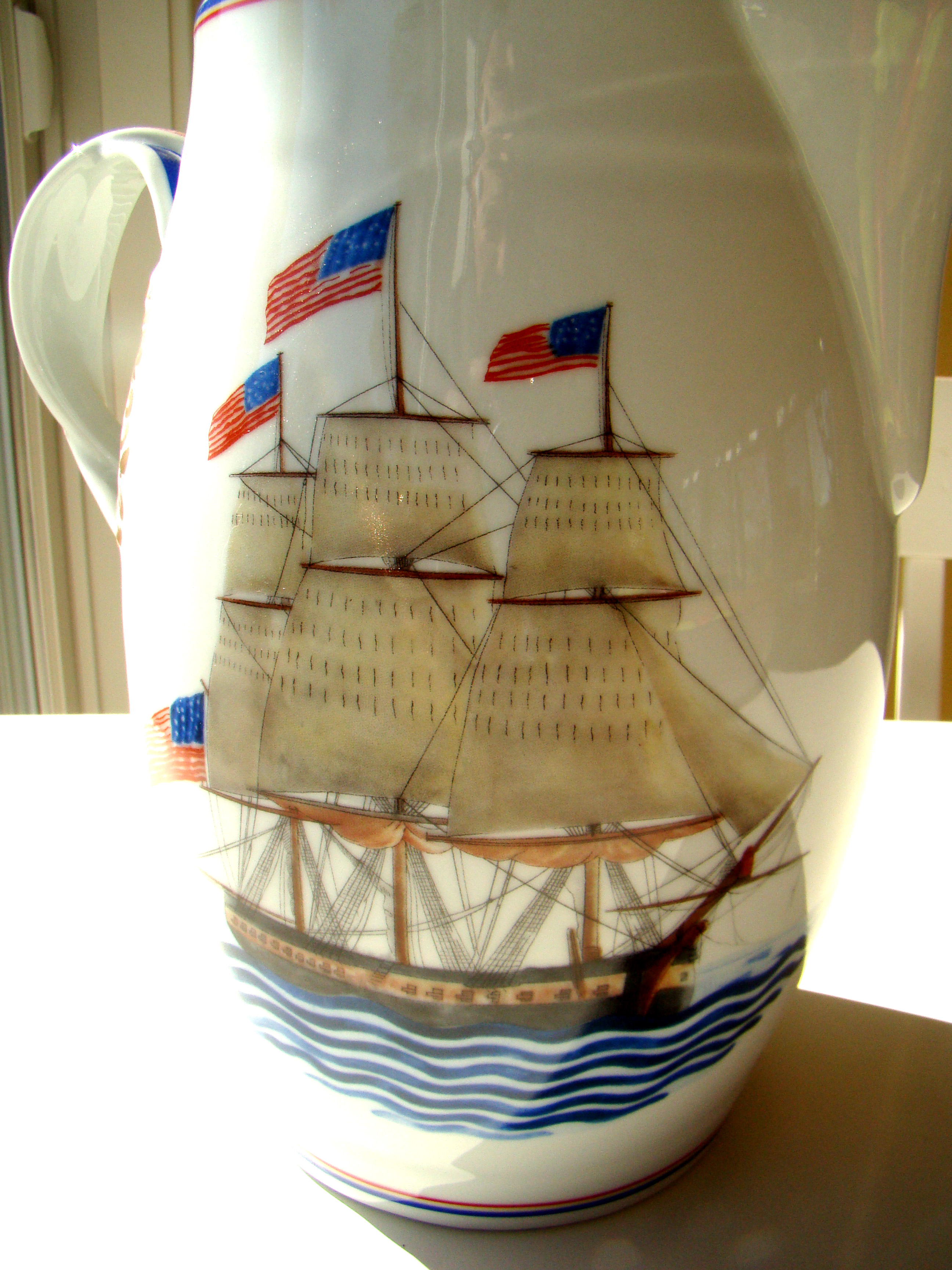 A fine commemorative pitcher depicting the U S S Constitution made by Mottahedeh of Portugal