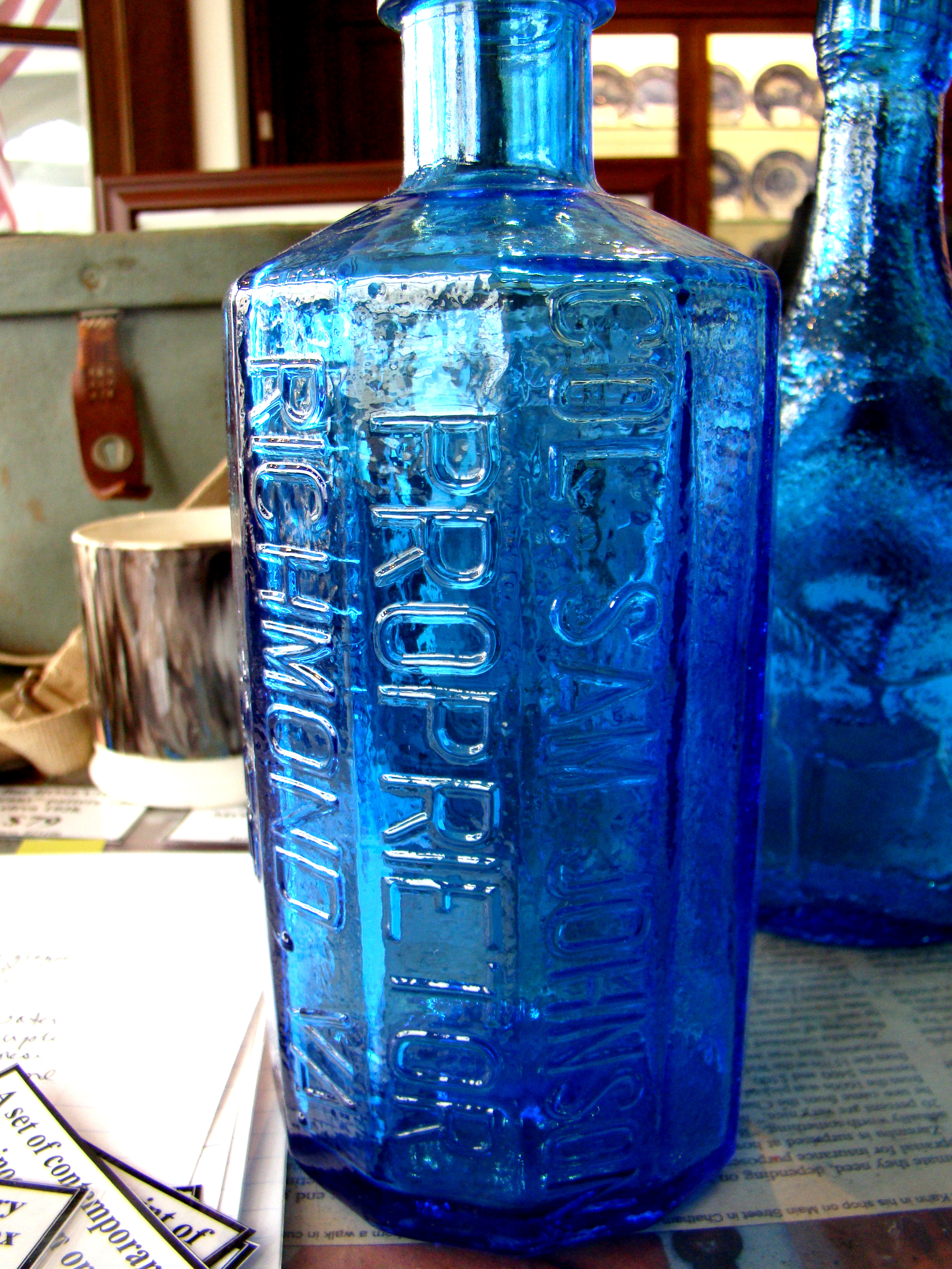 A collection of five reproduction aqua blue glass flasks and bottles — image 3