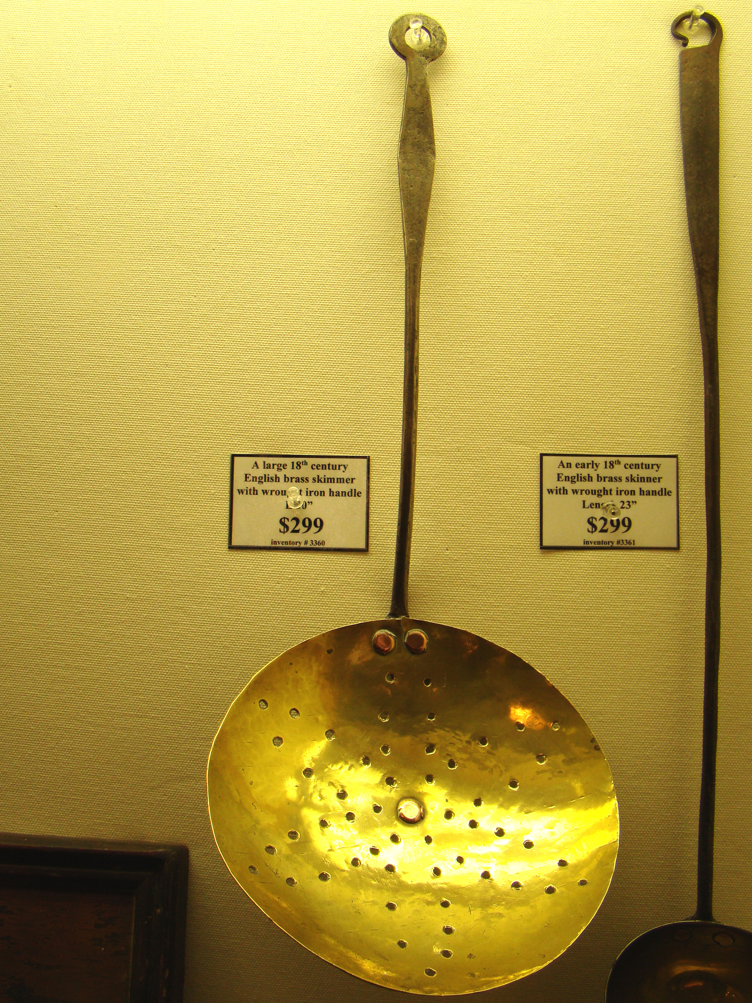 A large 18th century English brass skimmer with wrought iron handle