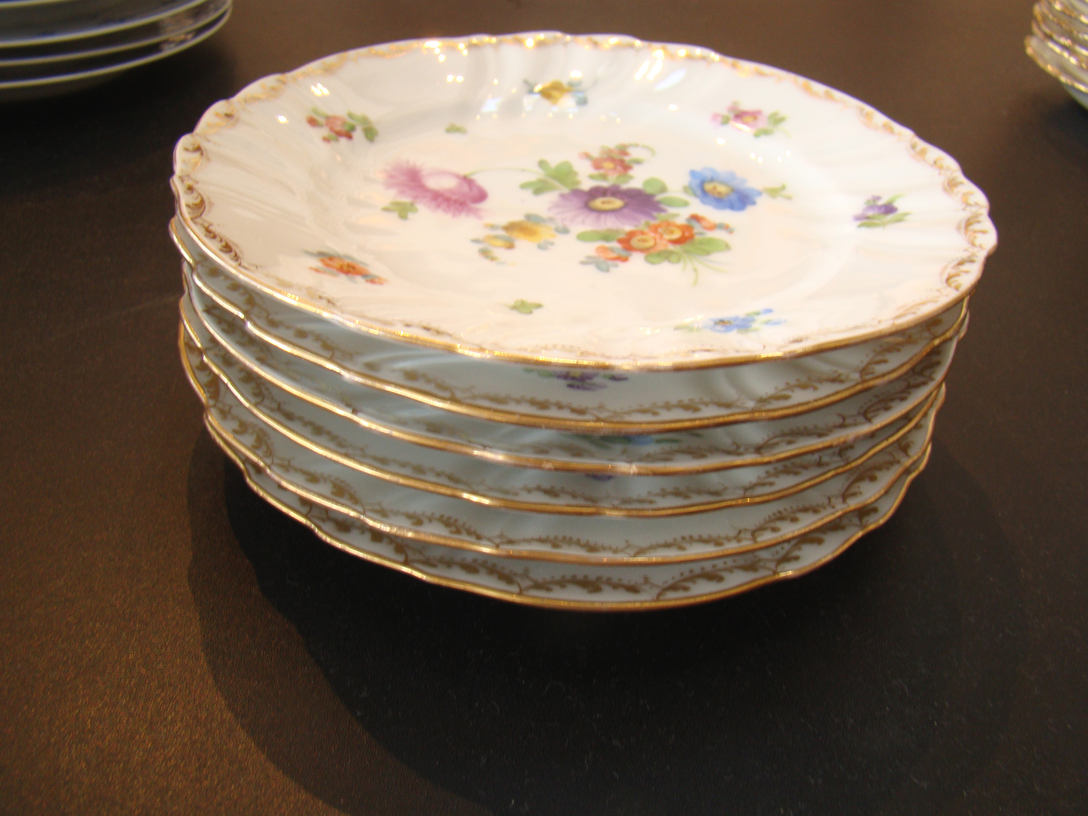 A beautiful set of six hand painted German porcelain plates circa 1900