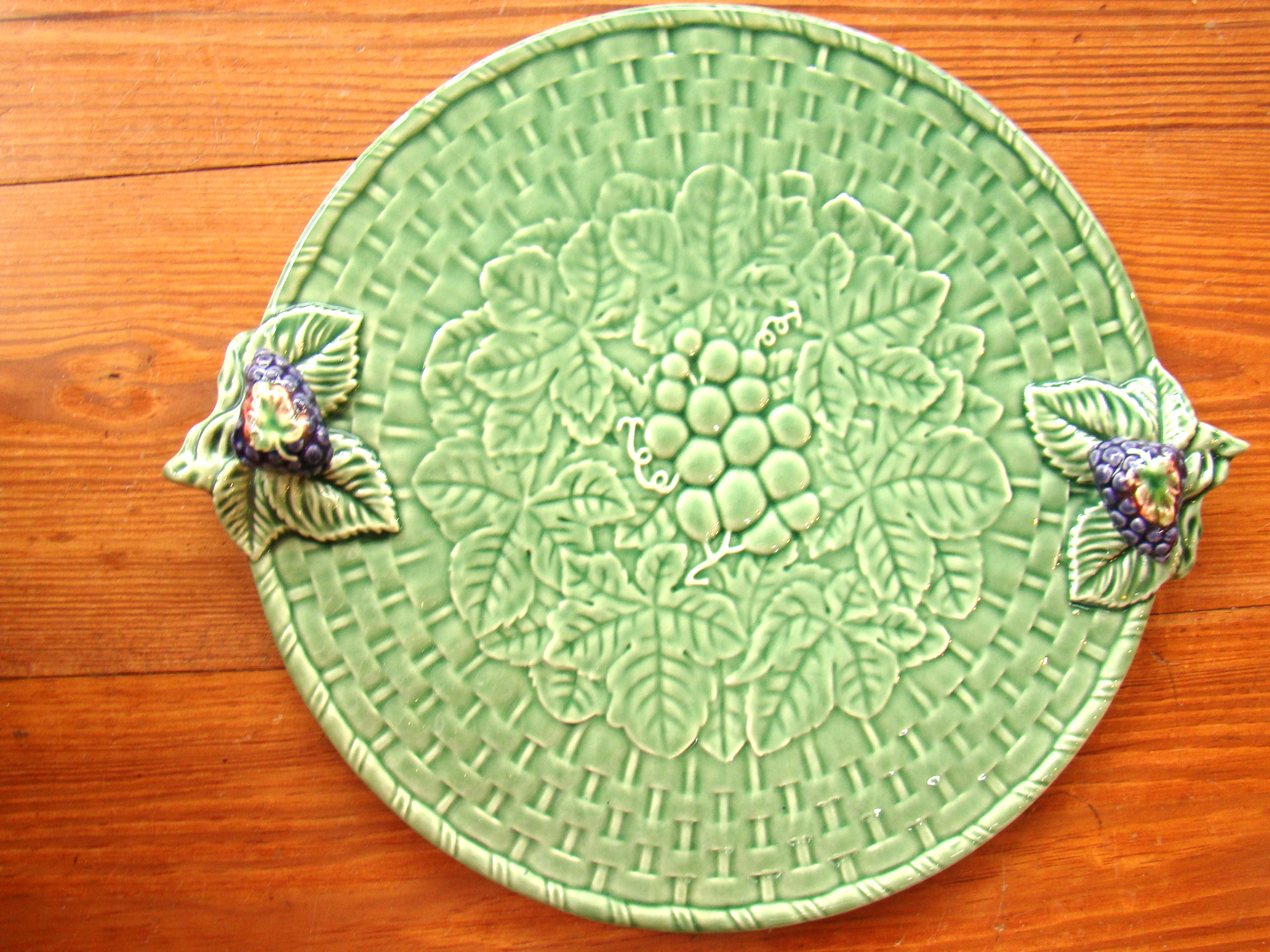 A beautiful vintage floral and grape pattern serving plate made in Portugal
