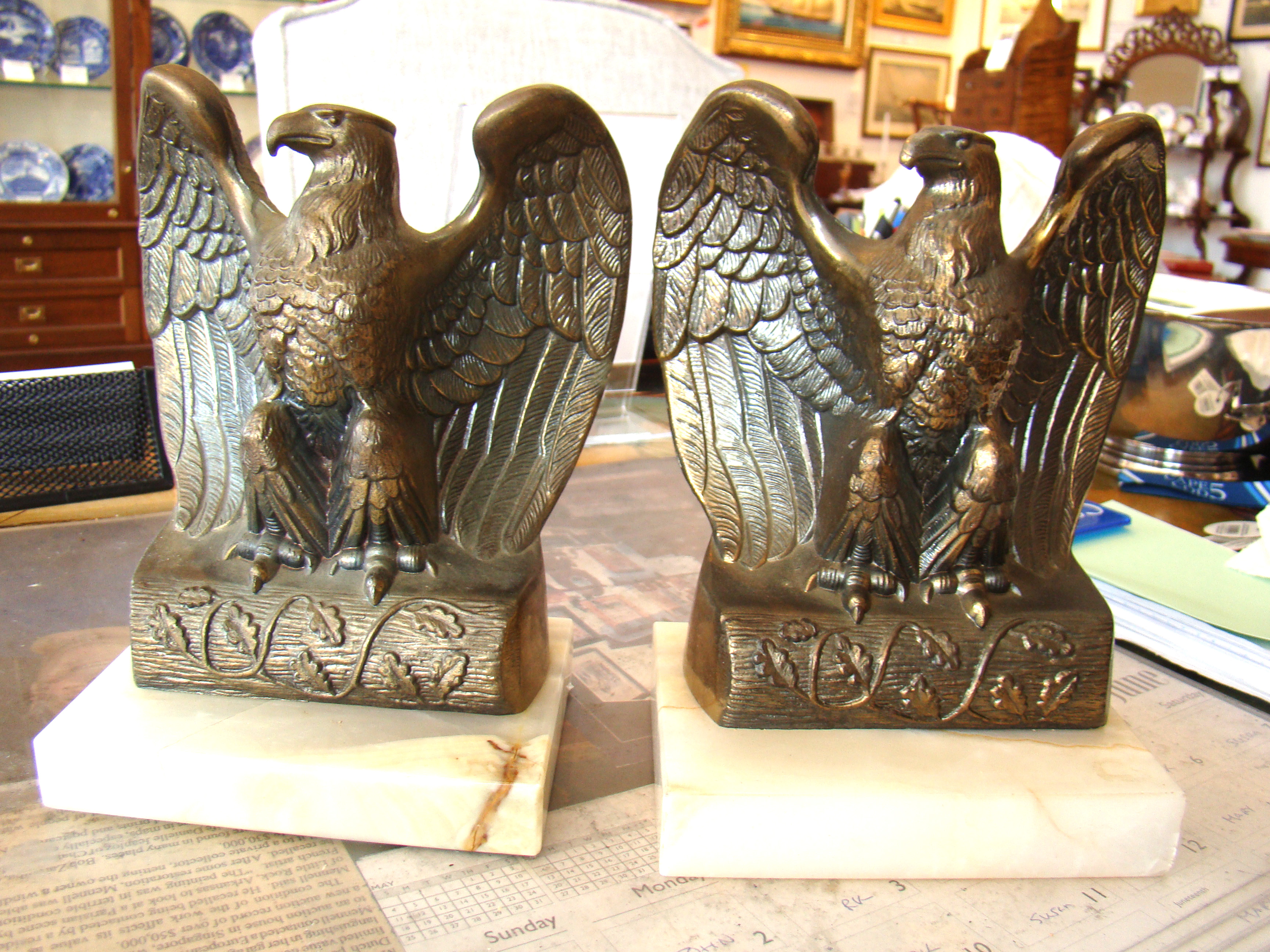 A fine pair of vintage brass eagle bookends mounted on onyx bases