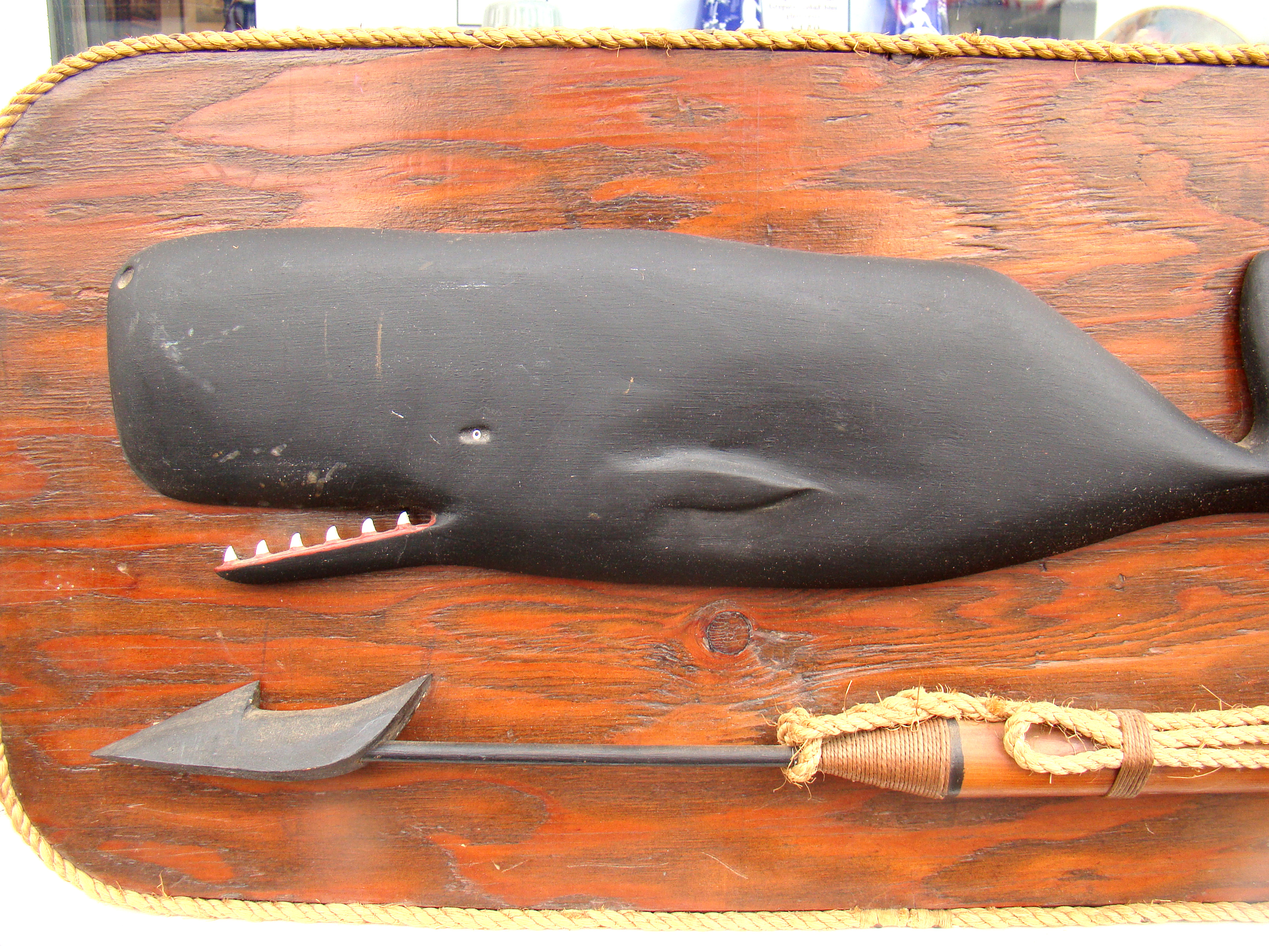A well-executed carving of a sperm whale mounted on a backboard along with a harpoon — image 2
